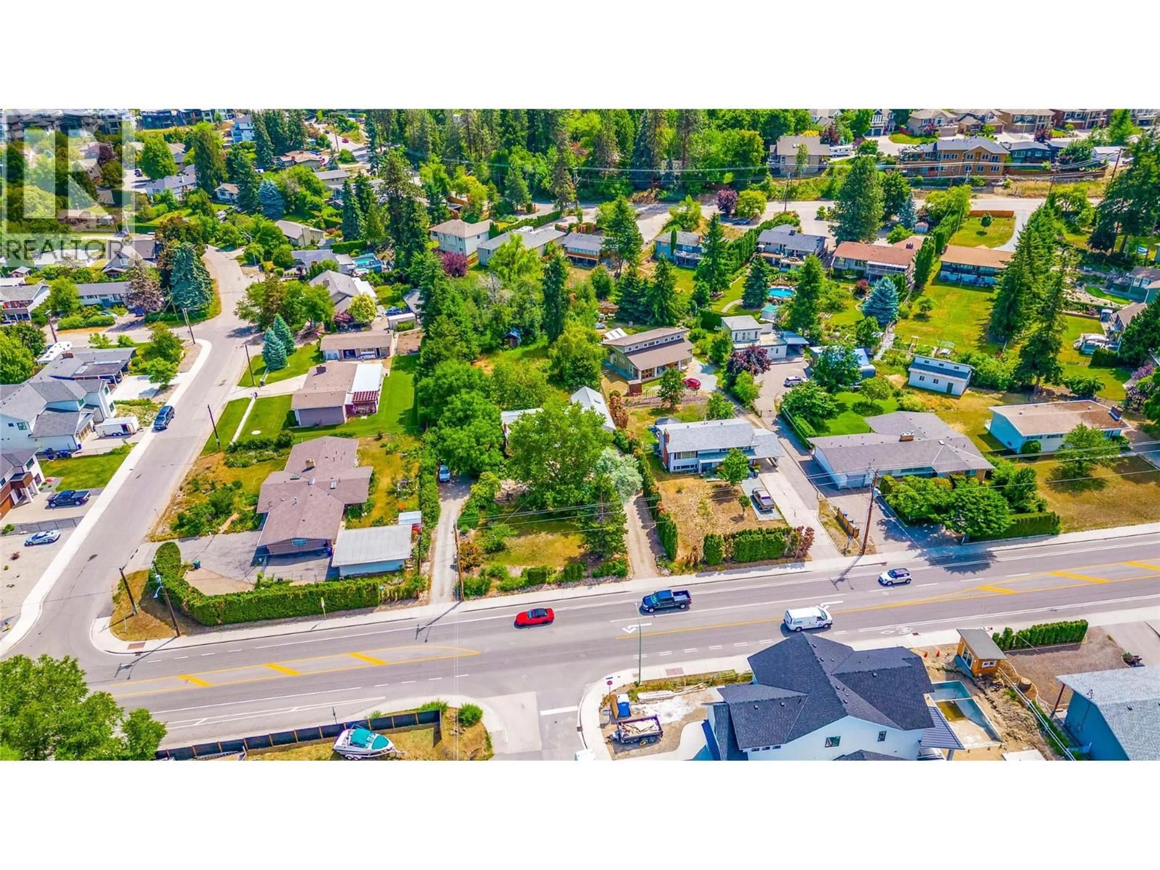 A pic from outside/outdoor area/front of a property/back of a property/a pic from drone, street for 709 HAZELL ROAD, Kelowna British Columbia V1W1R2