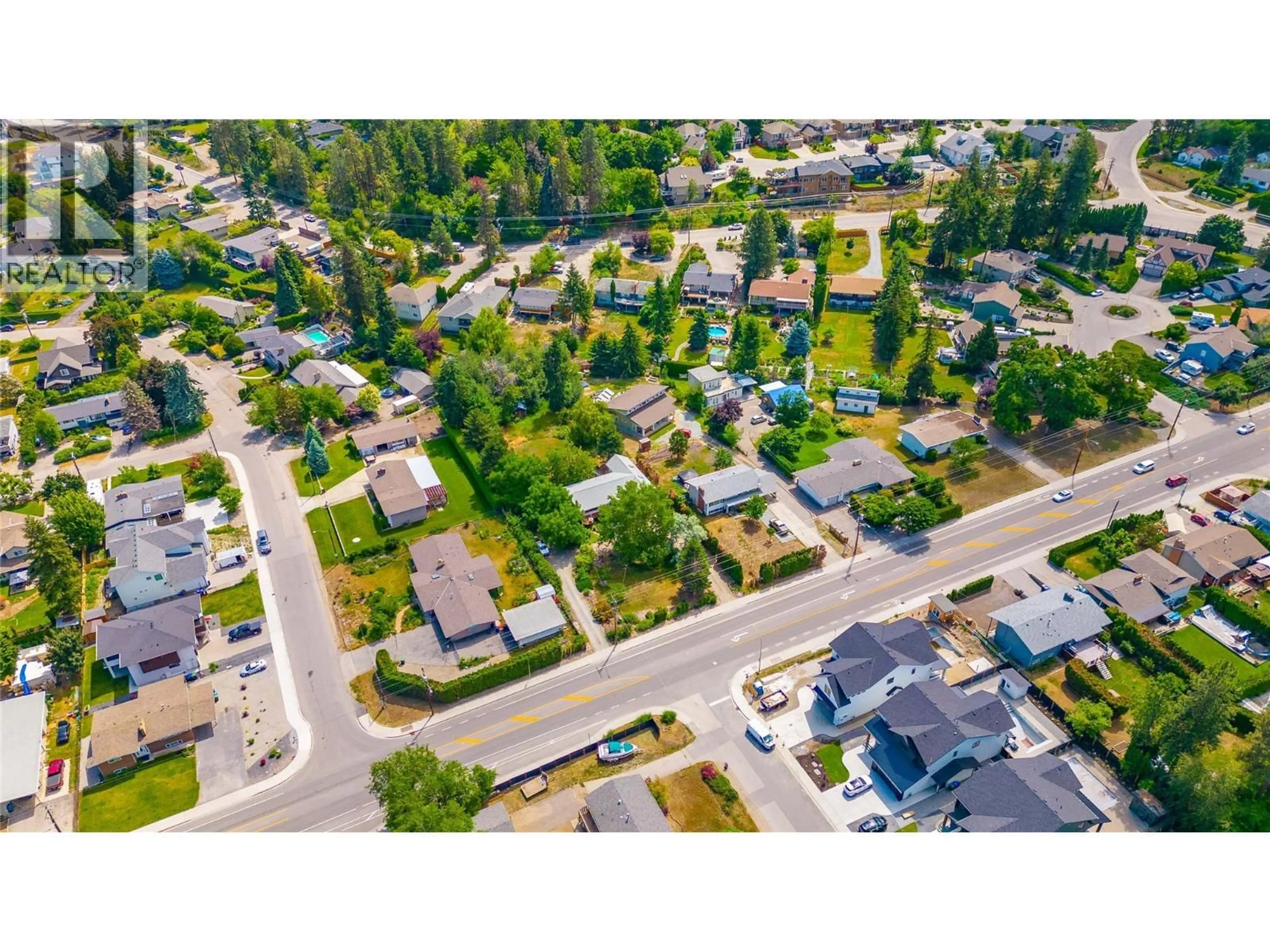 A pic from outside/outdoor area/front of a property/back of a property/a pic from drone, street for 709 HAZELL ROAD, Kelowna British Columbia V1W1R2