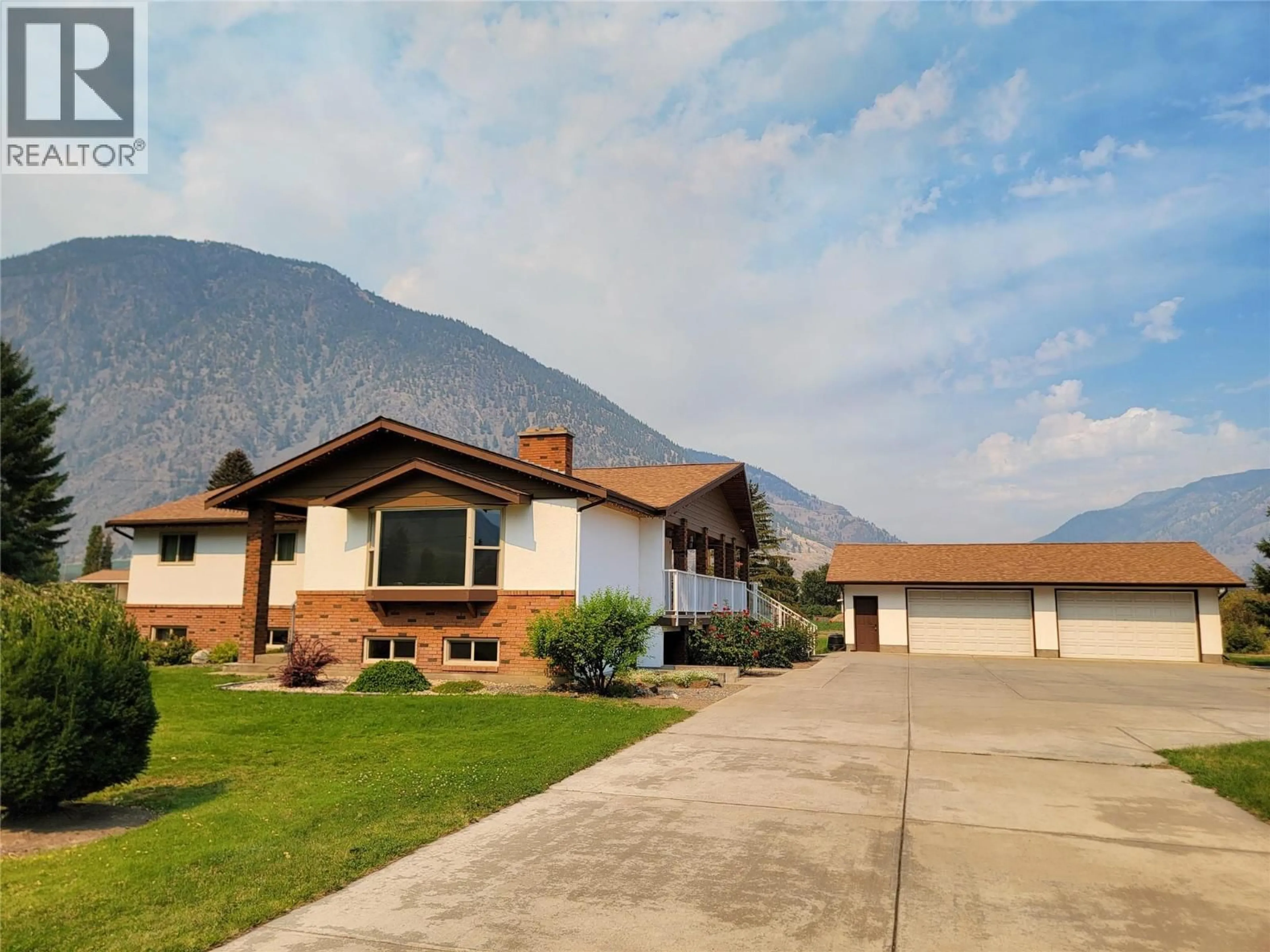 Home with vinyl exterior material, mountain view for 230 12TH AVENUE, Keremeos British Columbia V0X1N3