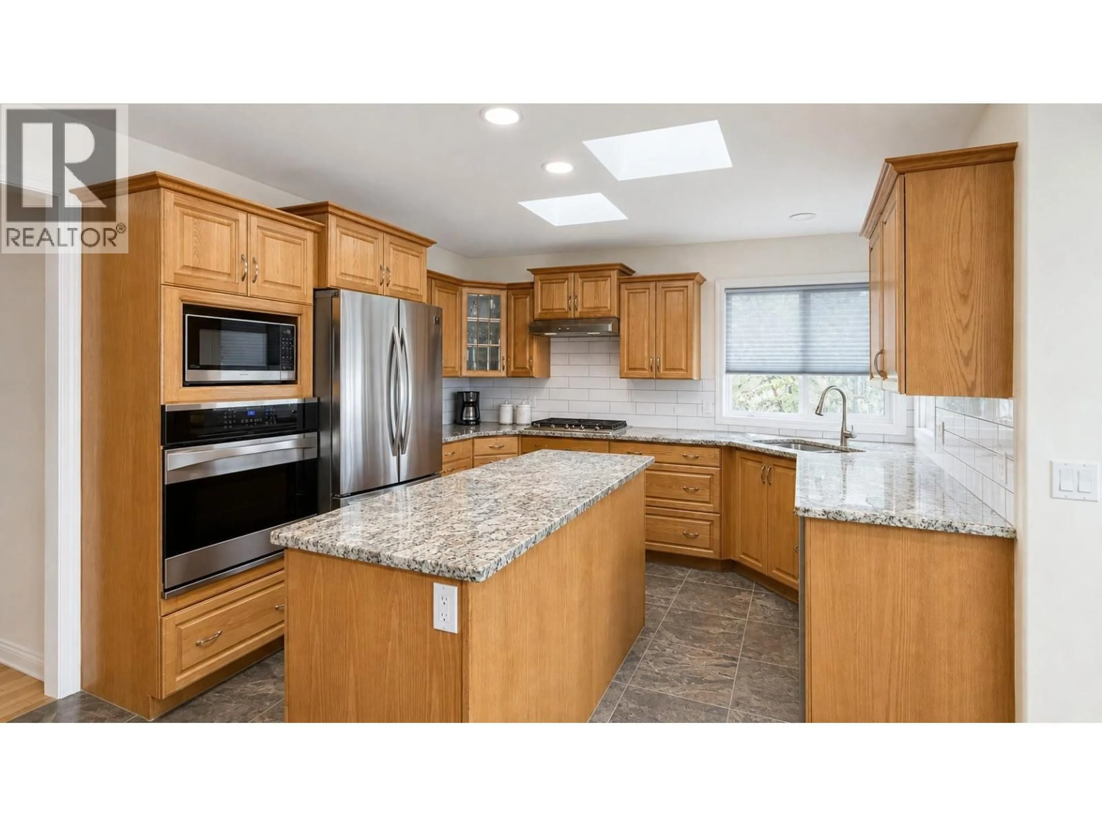 Open concept kitchen, ceramic/tile floor for 6519 SHERBURN ROAD, Peachland British Columbia V0H1X0