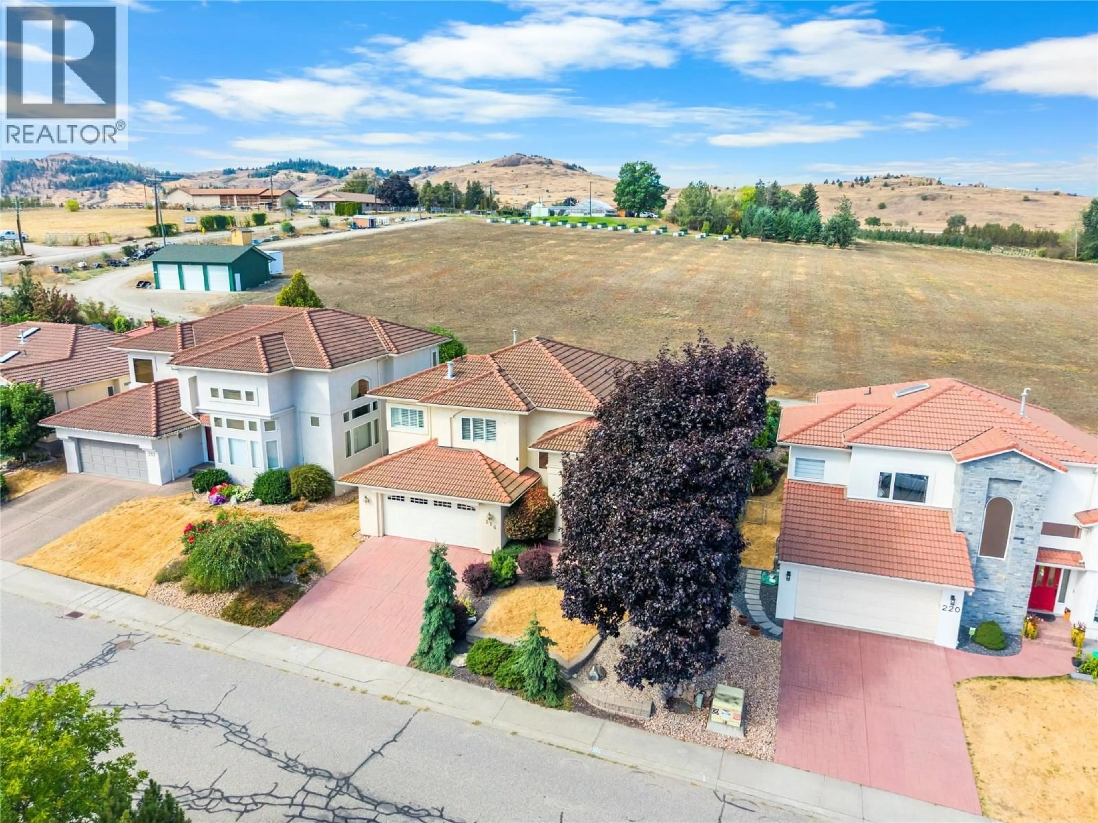 A pic from outside/outdoor area/front of a property/back of a property/a pic from drone, street for 216 COUNTRY ESTATE DRIVE, Vernon British Columbia V1B2V2