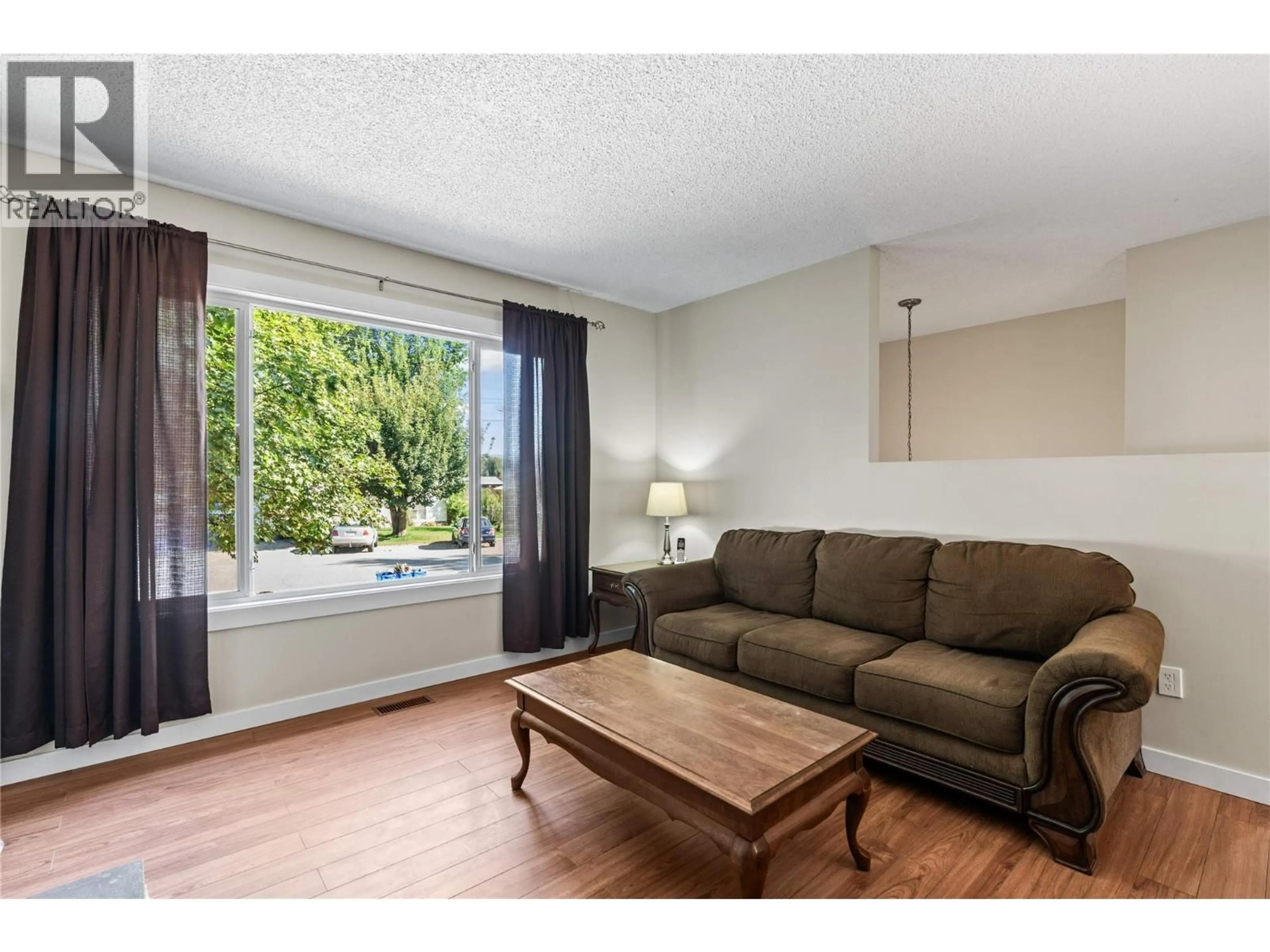 Living room with furniture, wood/laminate floor for 792 EASTWOOD ROAD, Lumby British Columbia V0E2G7