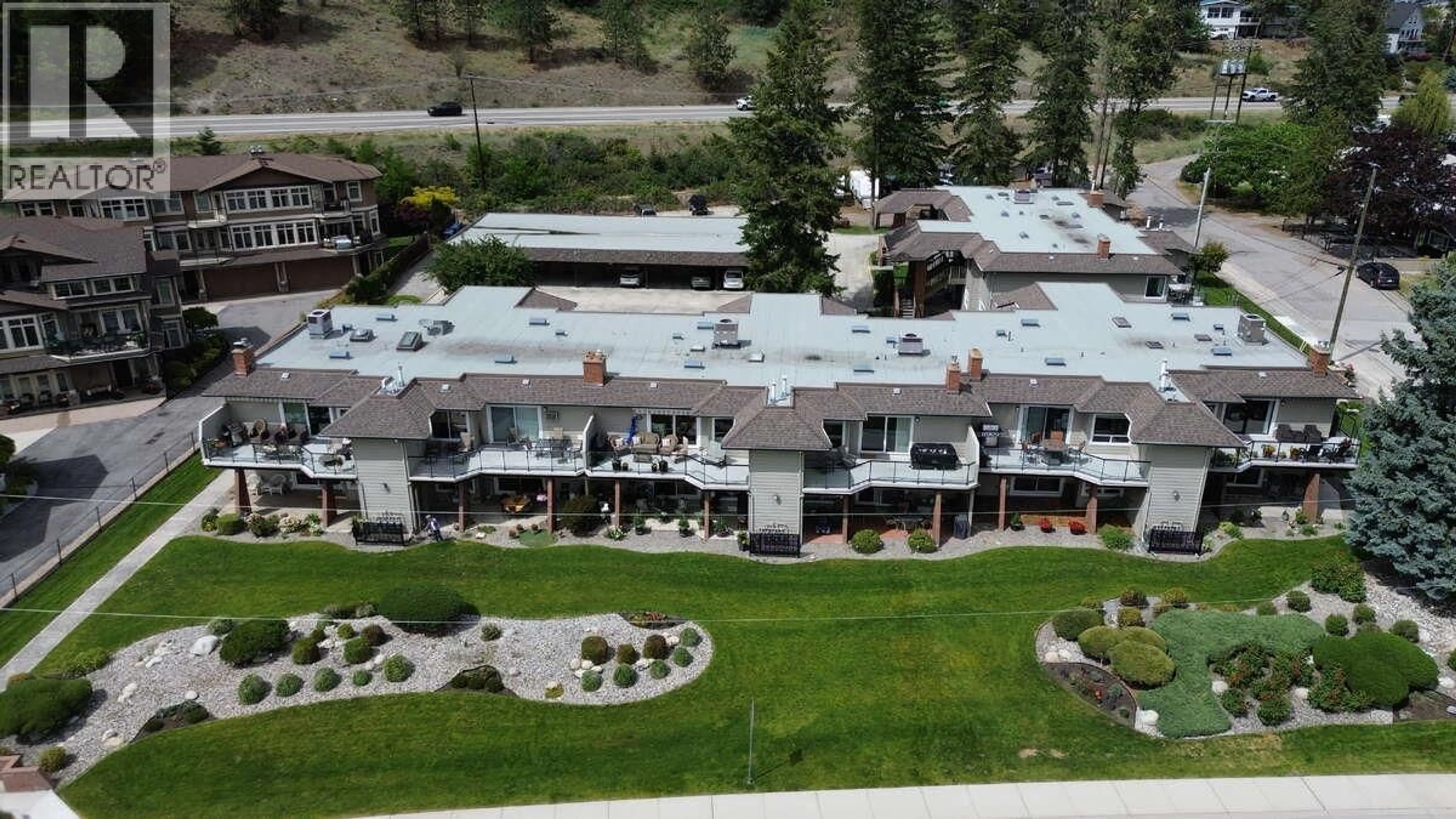 A pic from outside/outdoor area/front of a property/back of a property/a pic from drone, mountain view for 106 - 4340 BEACH AVENUE, Peachland British Columbia V0H1X6