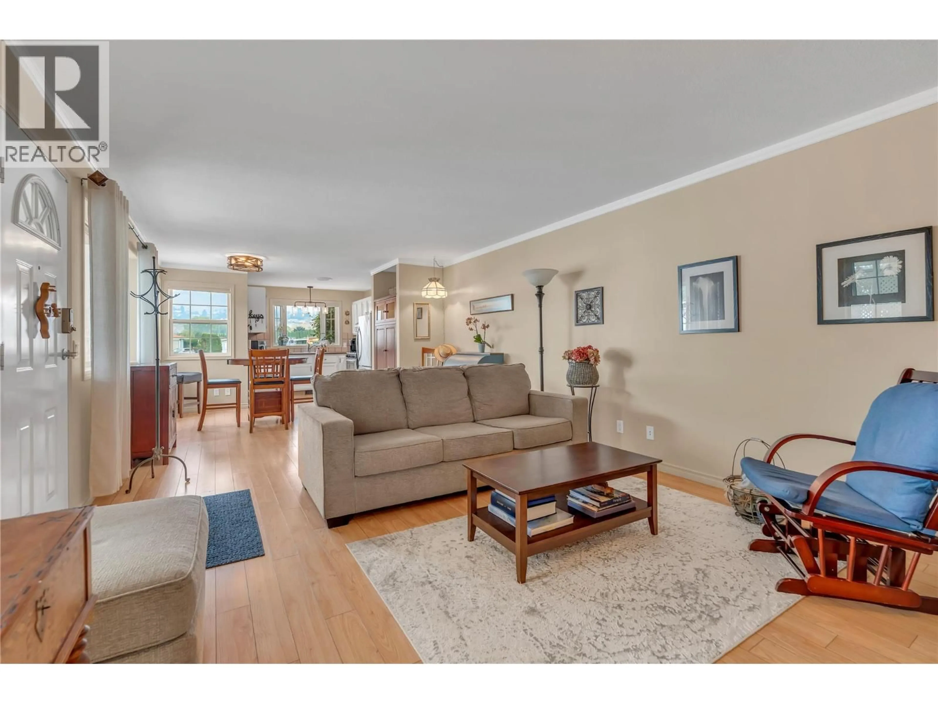 Living room with furniture, wood/laminate floor for 54 - 999 BURNABY AVENUE, Penticton British Columbia V2A1G7