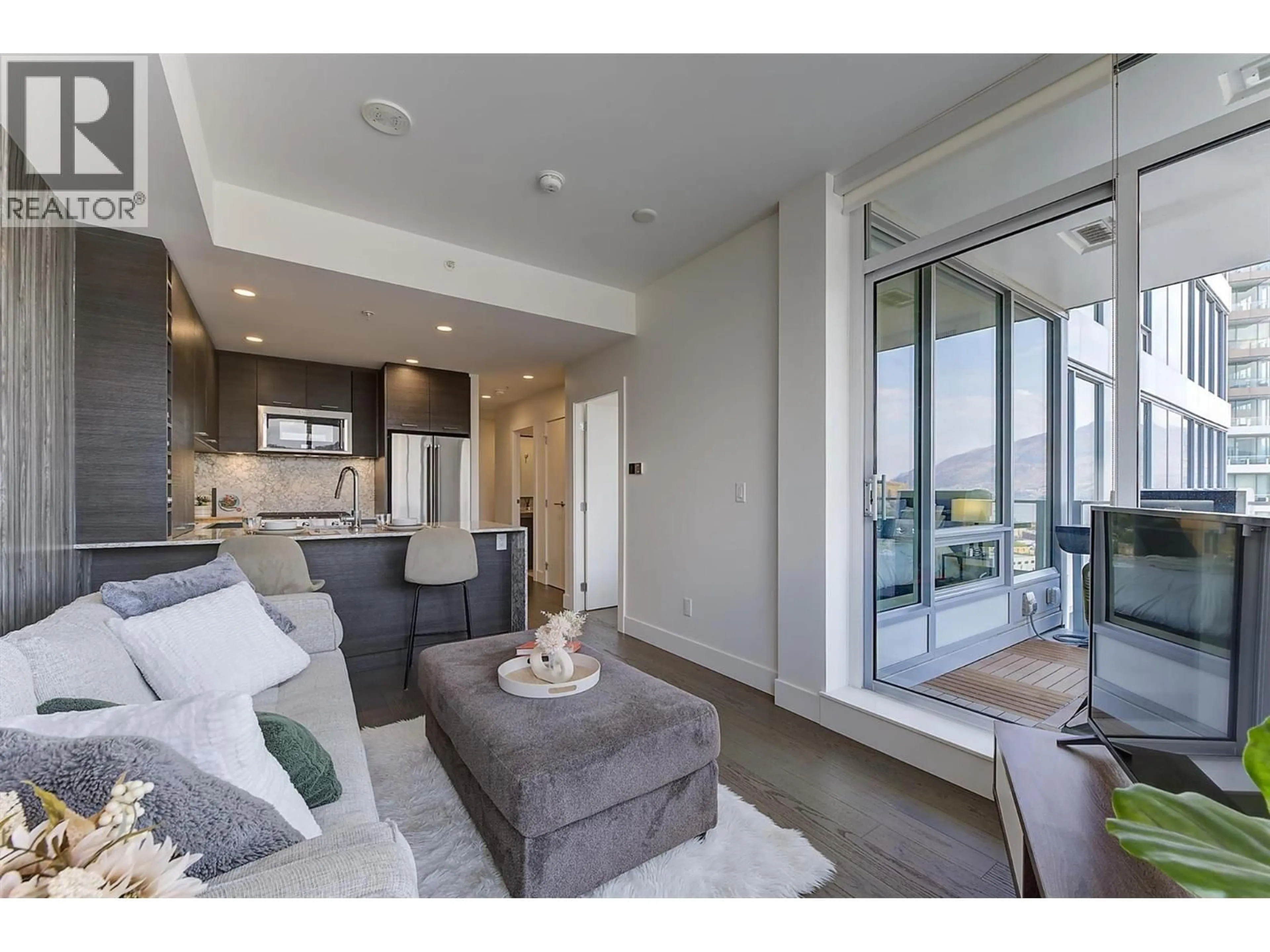 Living room with furniture, unknown for 1307 - 1191 SUNSET DRIVE, Kelowna British Columbia V1Y0J4