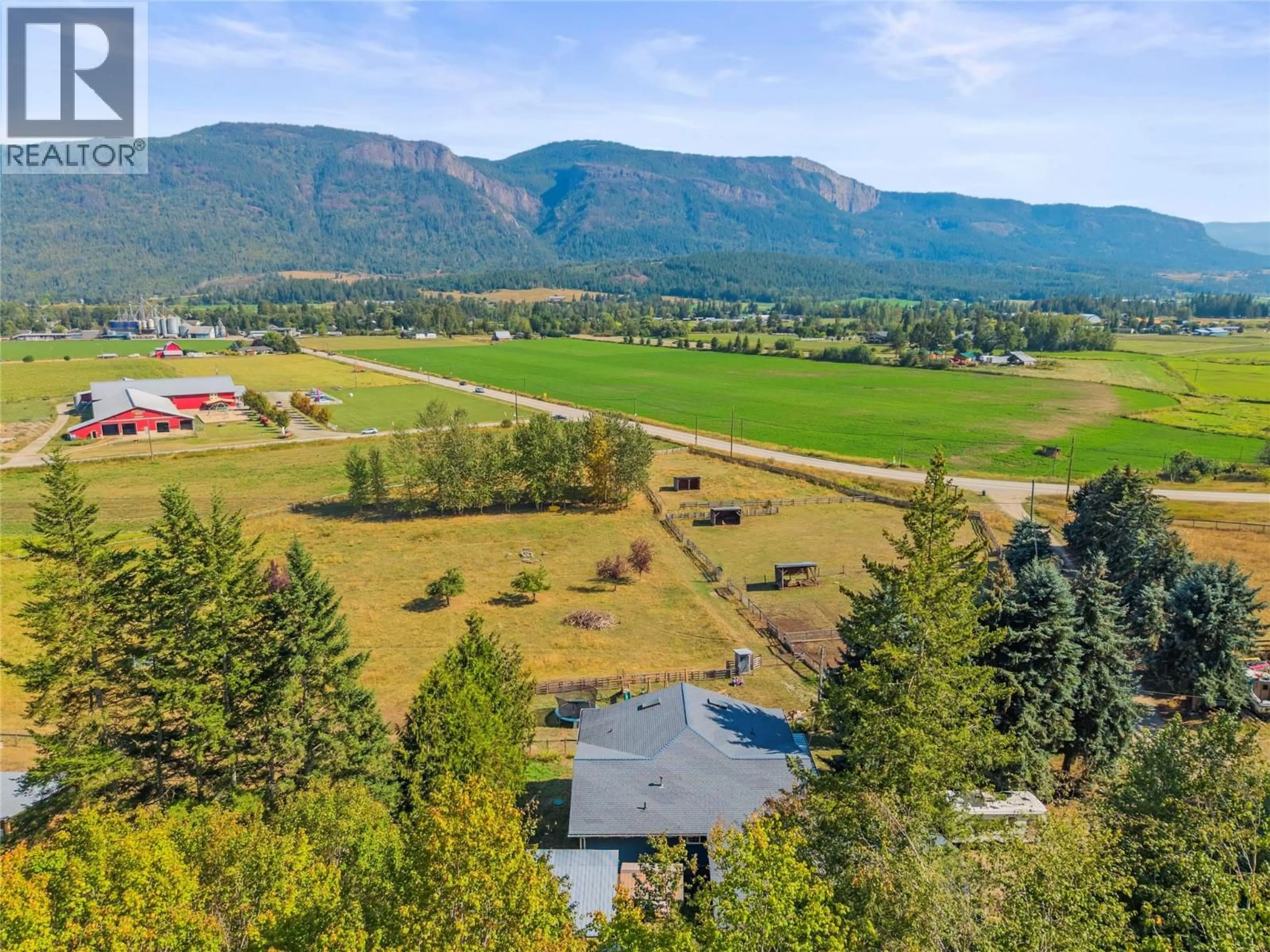 A pic from outside/outdoor area/front of a property/back of a property/a pic from drone, mountain view for 6778 97A HIGHWAY, Grindrod British Columbia V0E1V0