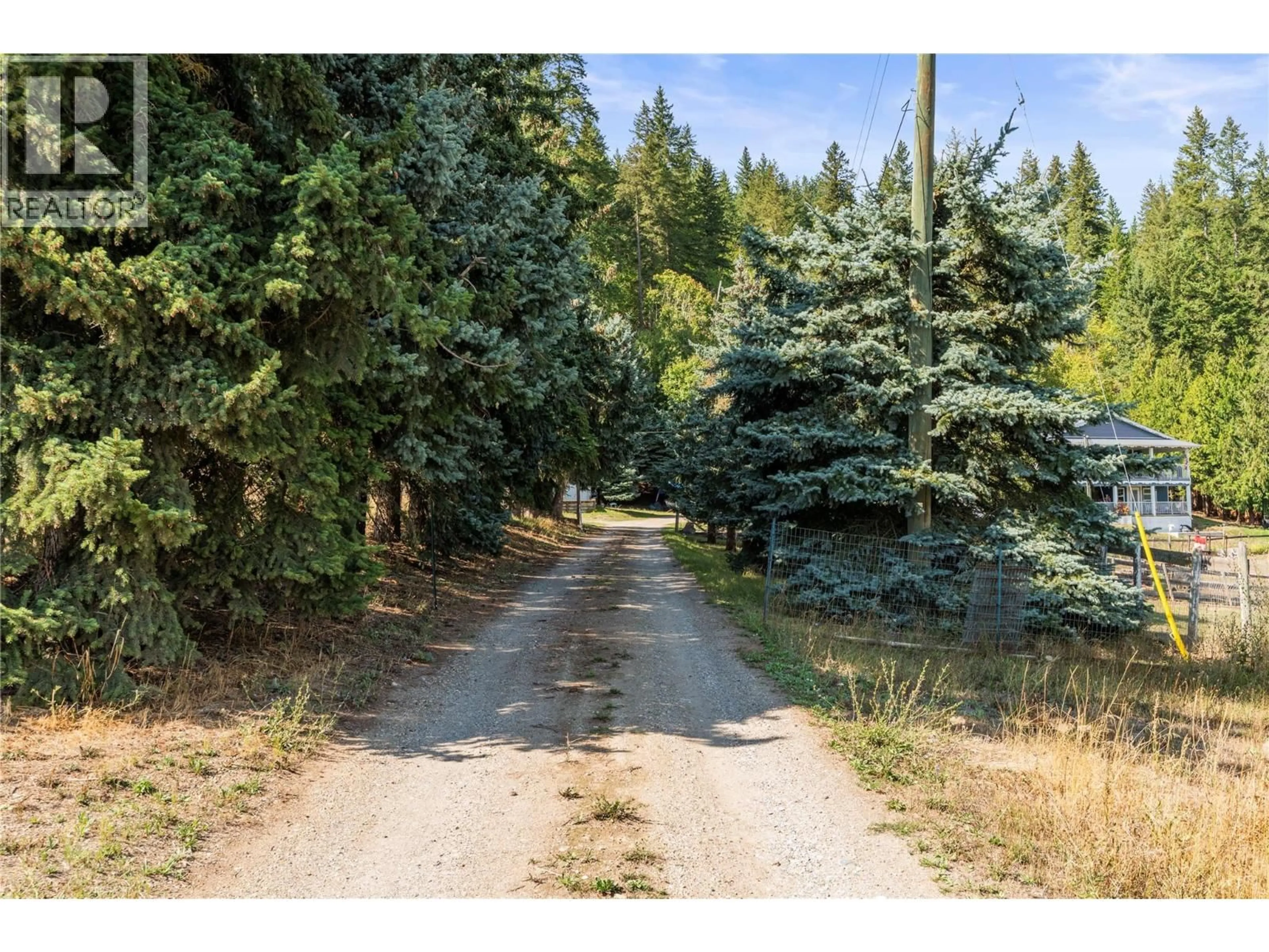 A pic from outside/outdoor area/front of a property/back of a property/a pic from drone, forest/trees view for 6778 97A HIGHWAY, Grindrod British Columbia V0E1V0