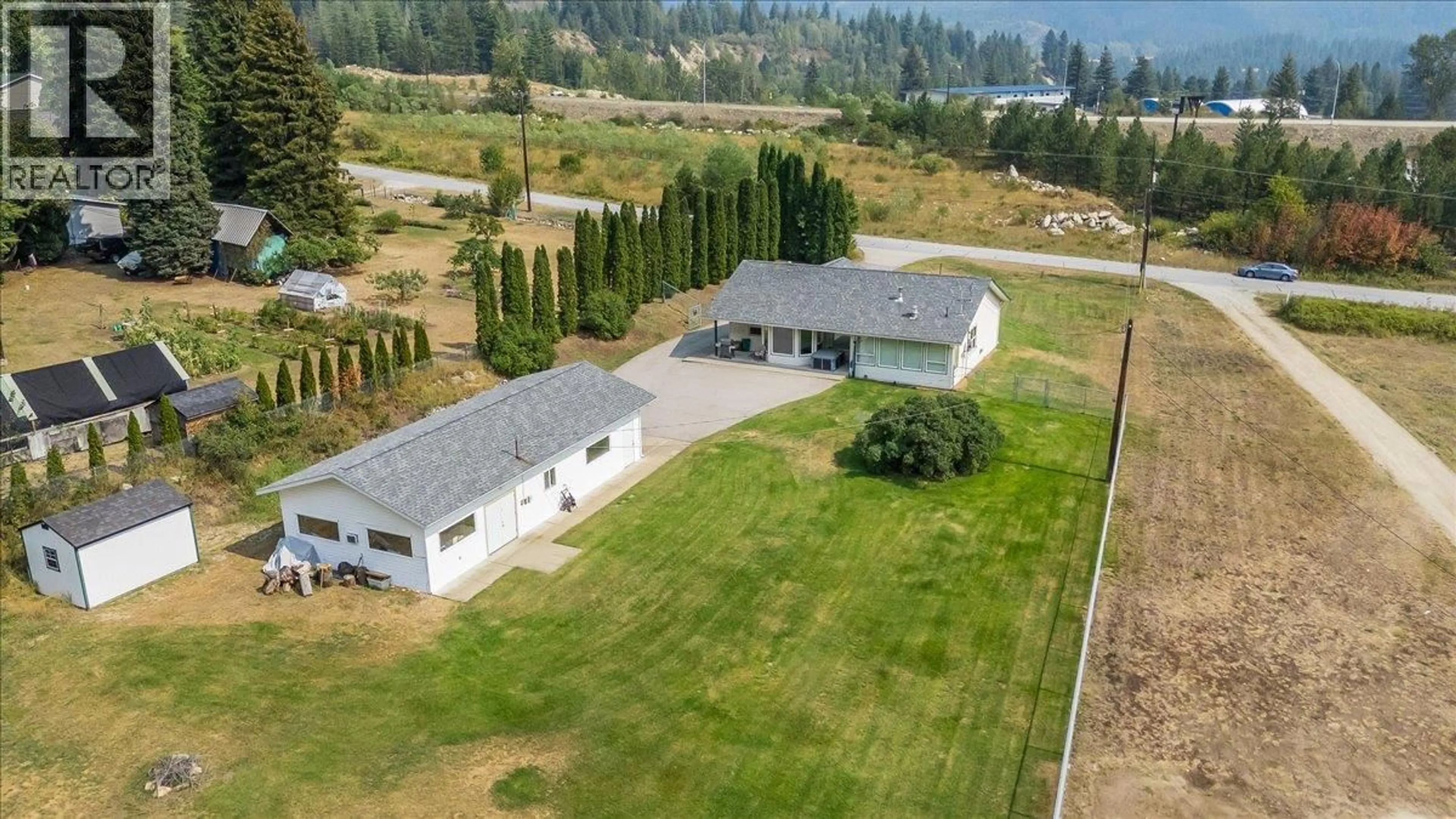 A pic from outside/outdoor area/front of a property/back of a property/a pic from drone, unknown for 900 CHINA CREEK ROAD, Genelle British Columbia V0G1G0