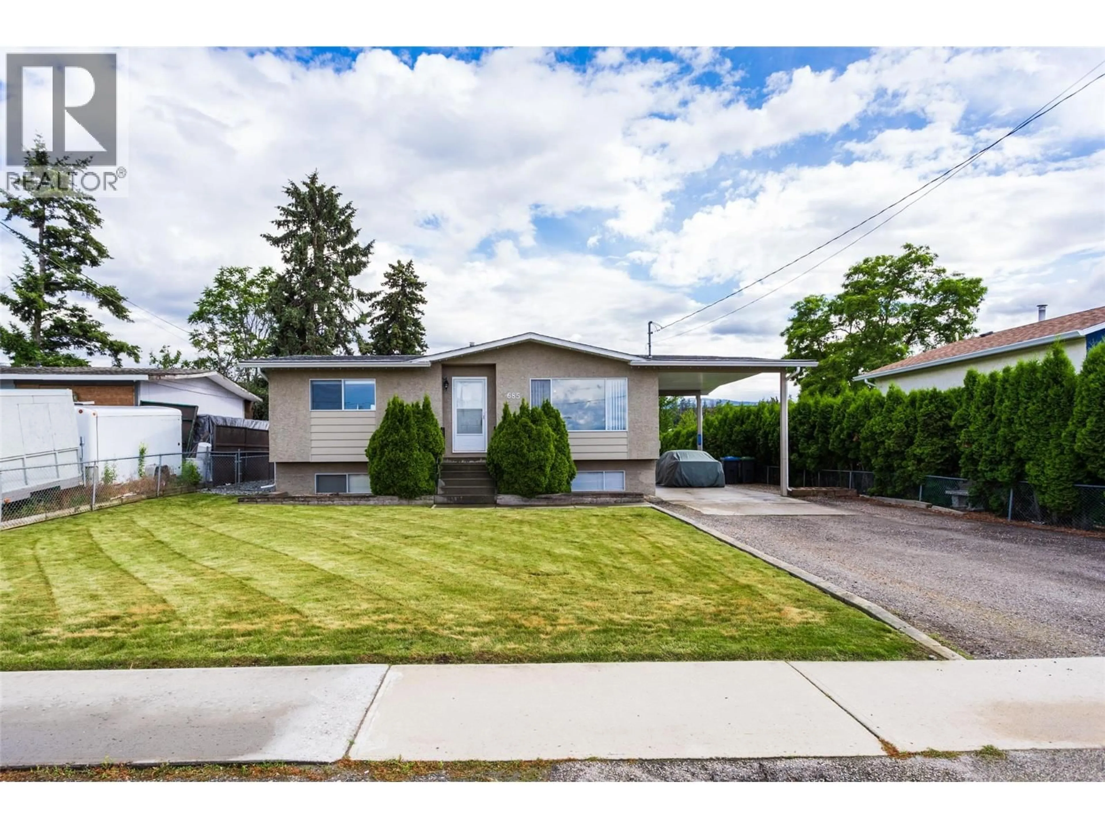 Home with vinyl exterior material, street for 685 QUIGLEY ROAD, Kelowna British Columbia V1X1A6