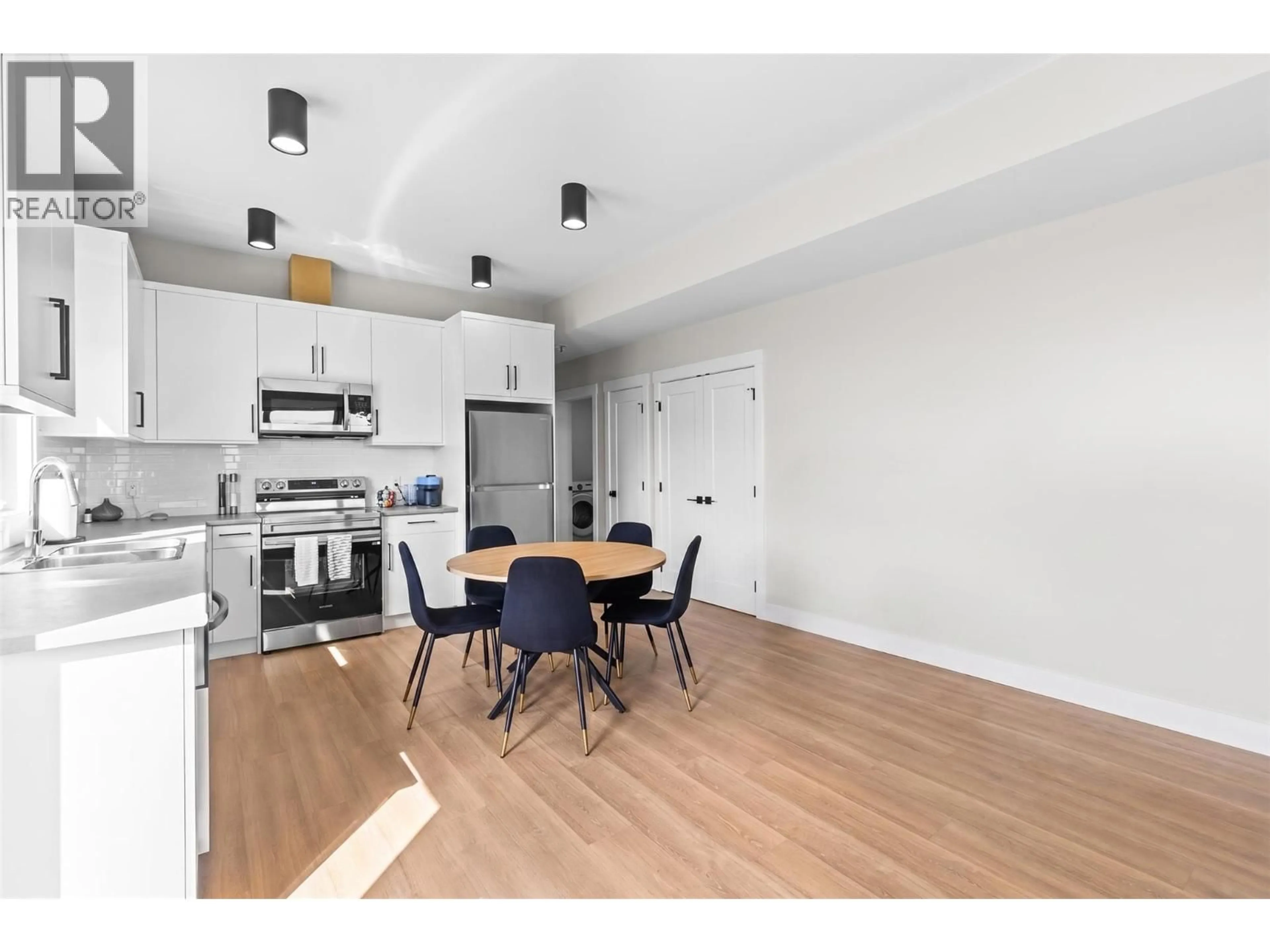 Open concept kitchen, wood/laminate floor for 2531 PINNACLE RIDGE DRIVE, West Kelowna British Columbia V4T0G4