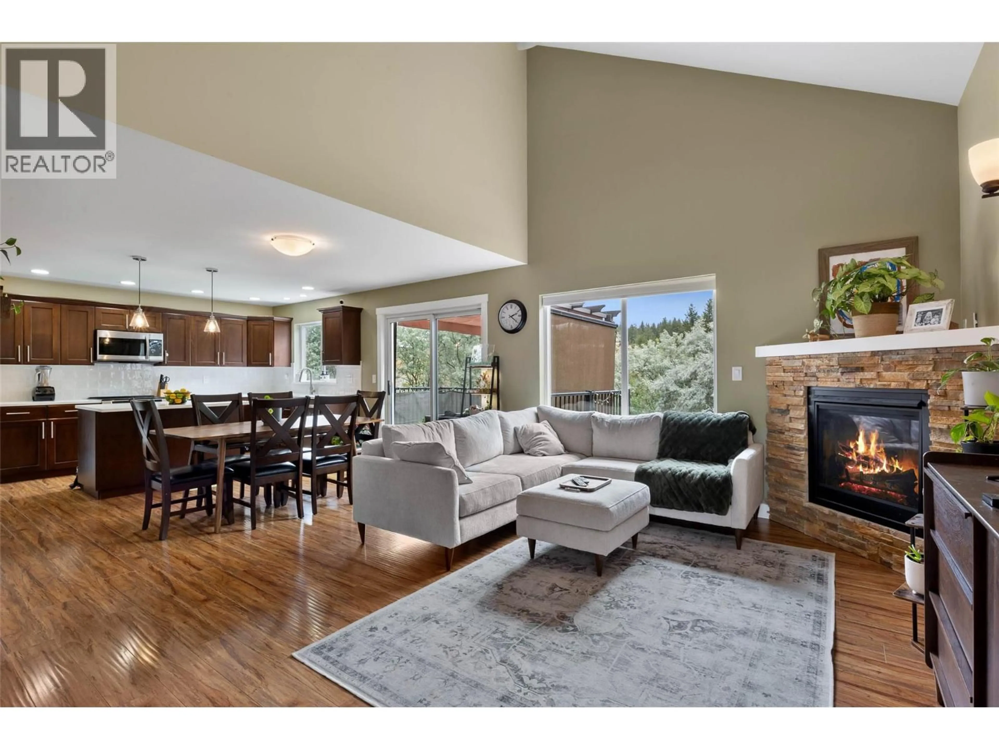 Living room with furniture, wood/laminate floor for 1948 SNOWBERRY CRESCENT, Kamloops British Columbia V1S1Z8