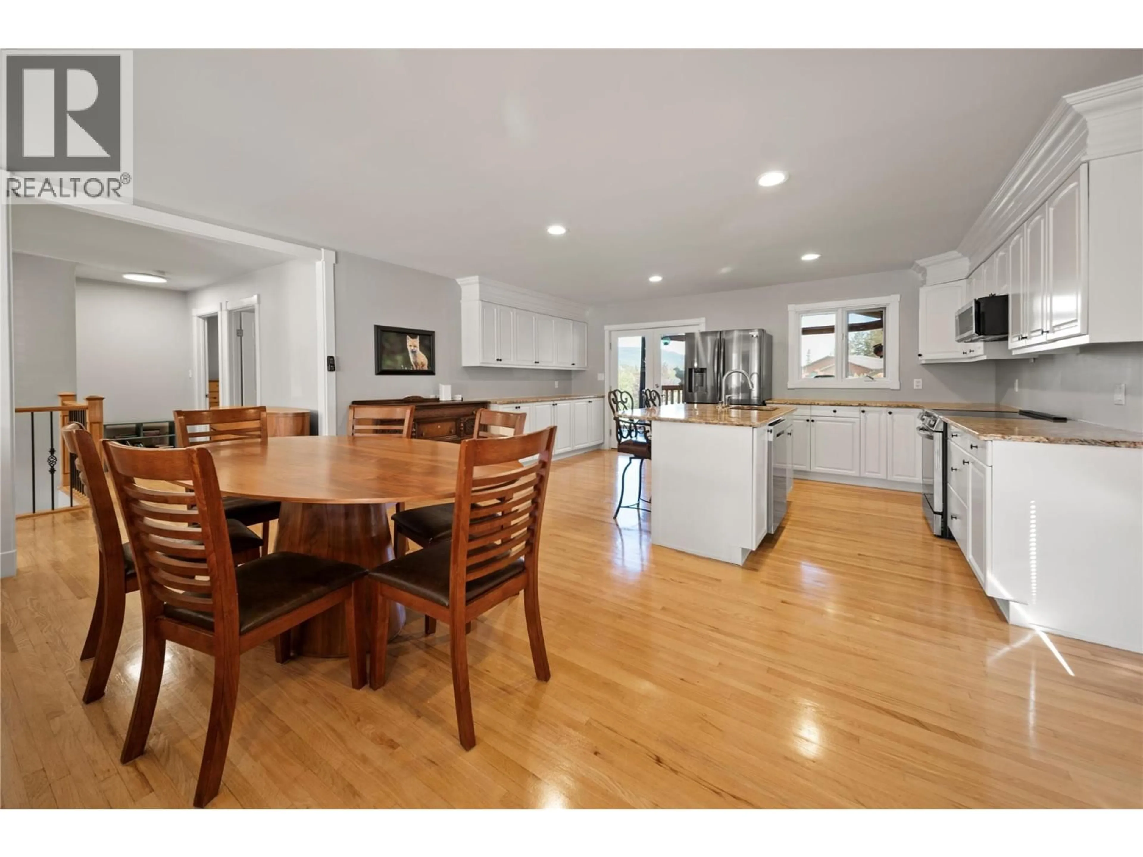 Open concept kitchen, wood/laminate floor for 5045 RIVERVIEW ROAD, Fairmont Hot Springs British Columbia V0B1L1
