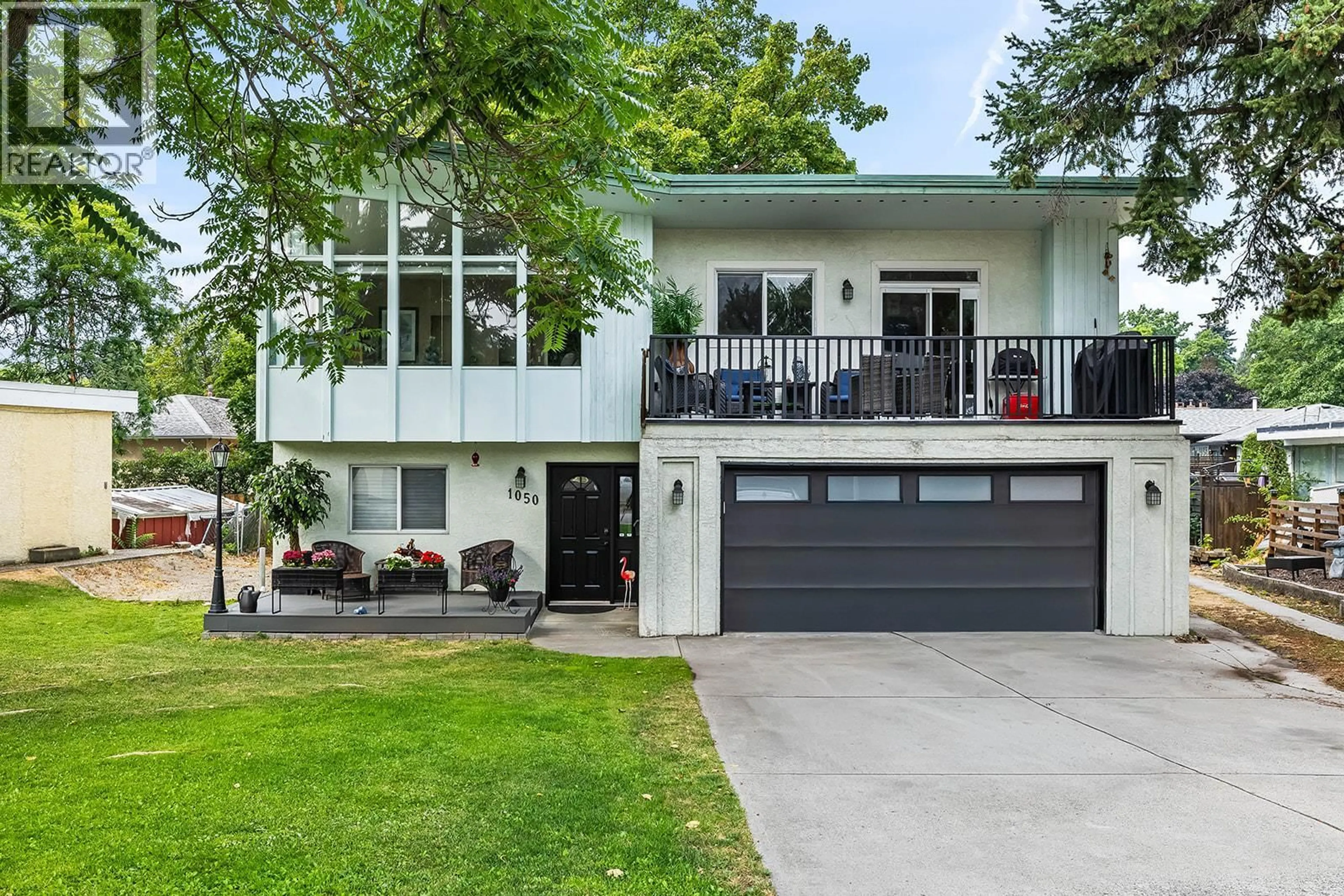 Home with vinyl exterior material, street for 1050 PINECREST LANE, Kelowna British Columbia V1Y4L3