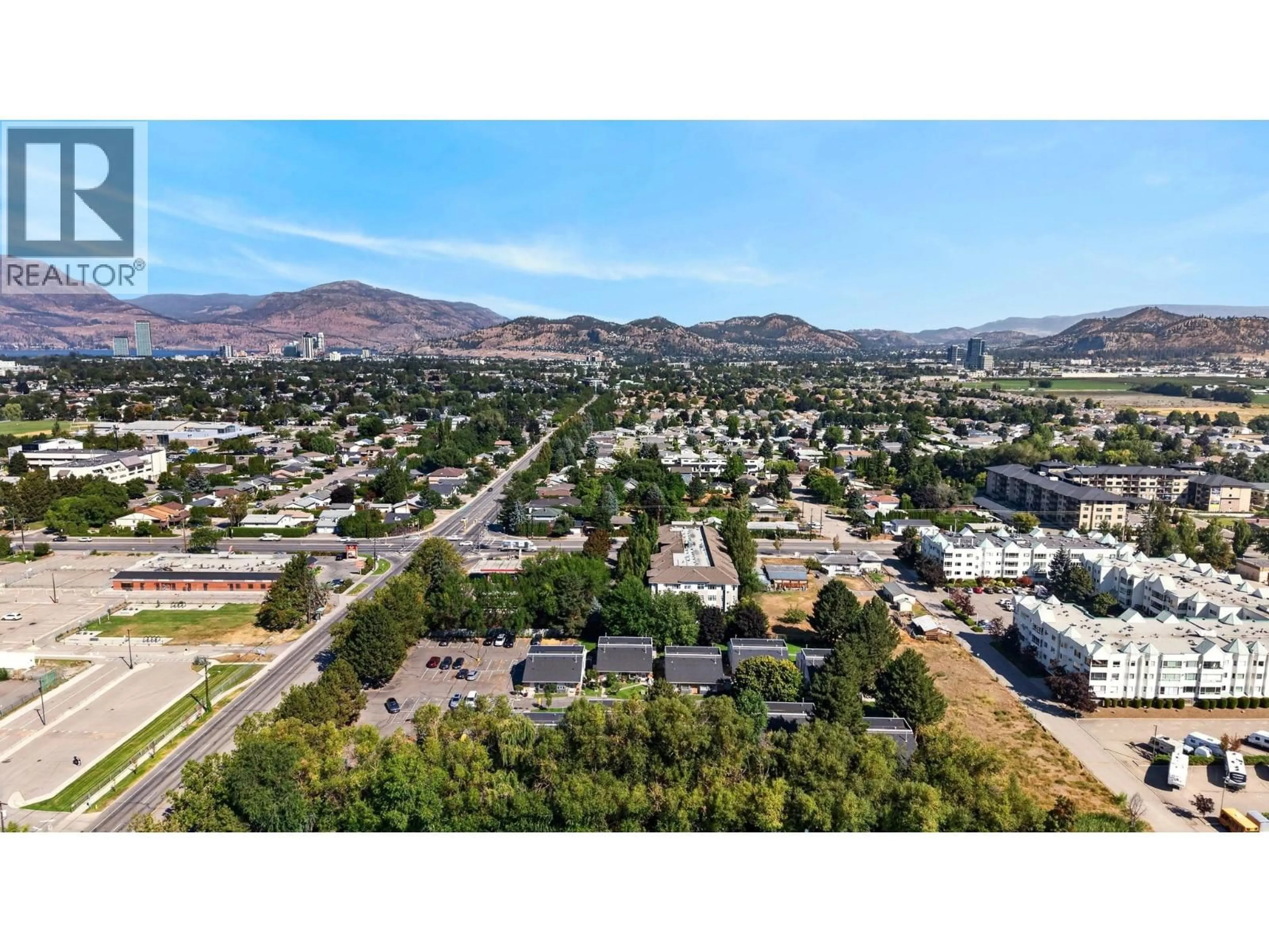 A pic from outside/outdoor area/front of a property/back of a property/a pic from drone, mountain view for 104 - 3155 GORDON DRIVE, Kelowna British Columbia V1W3N5