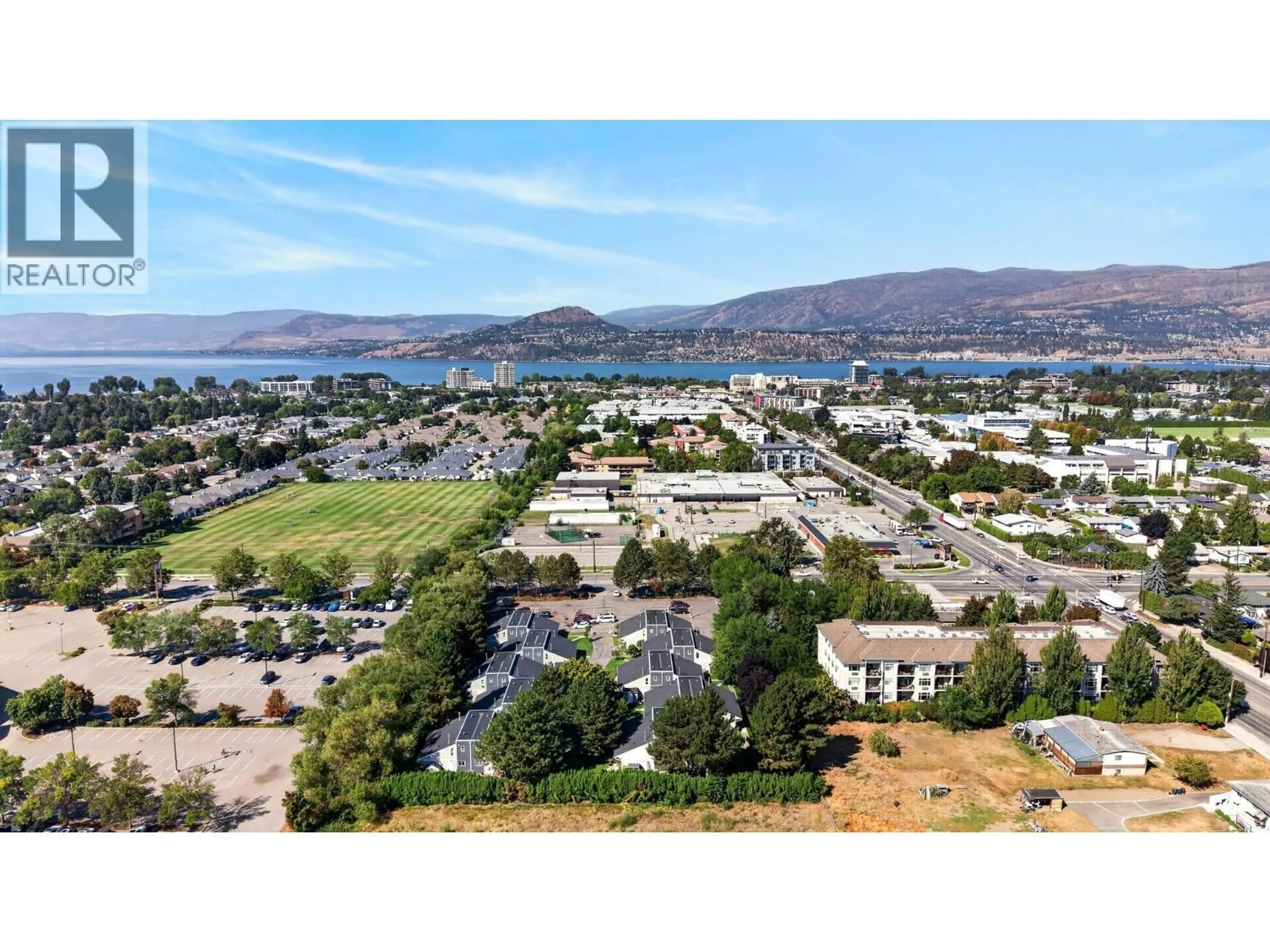 A pic from outside/outdoor area/front of a property/back of a property/a pic from drone, mountain view for 104 - 3155 GORDON DRIVE, Kelowna British Columbia V1W3N5