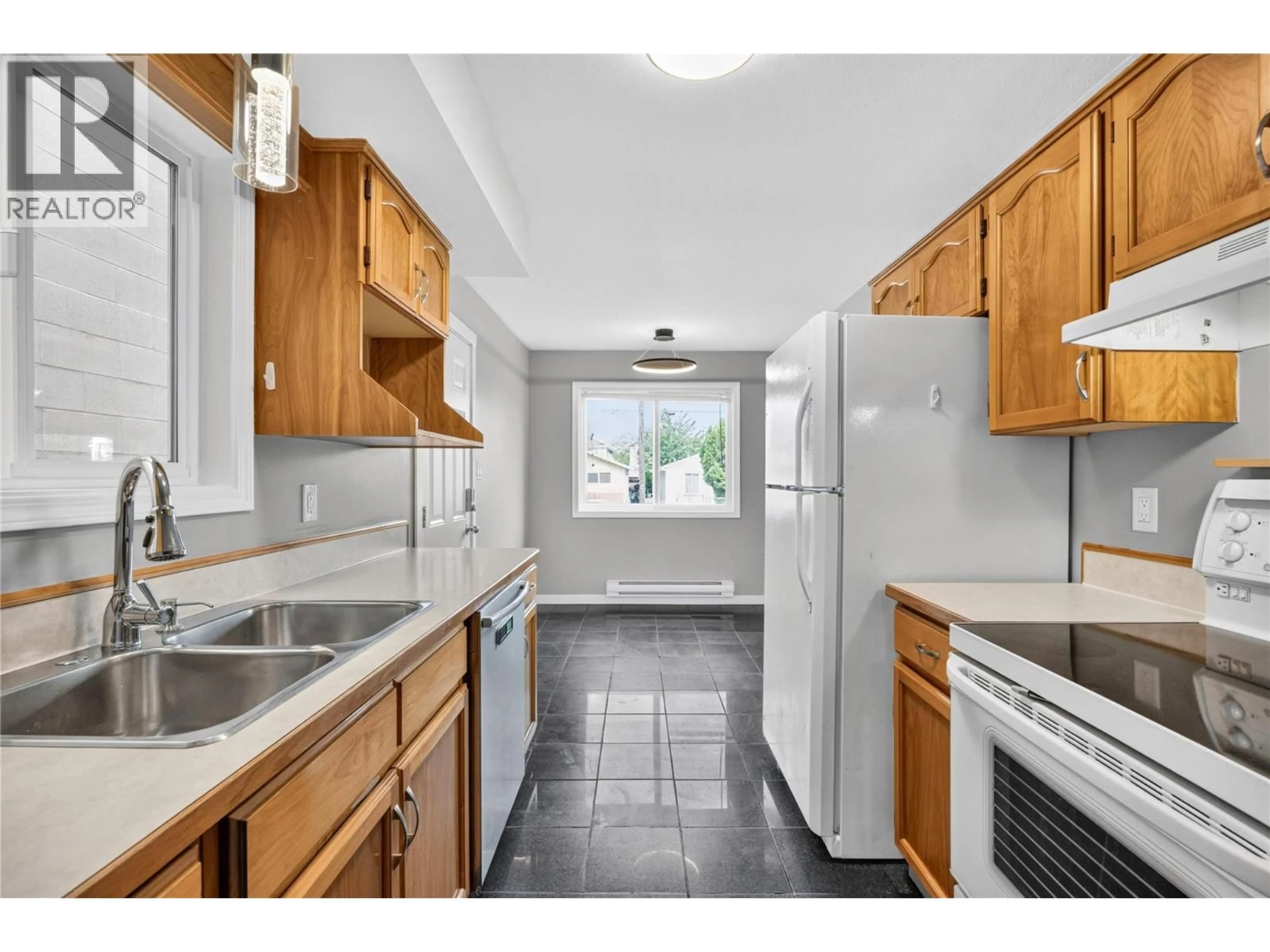 Standard kitchen, ceramic/tile floor for 101 - 460 RENE AVENUE, Penticton British Columbia V2A7M2