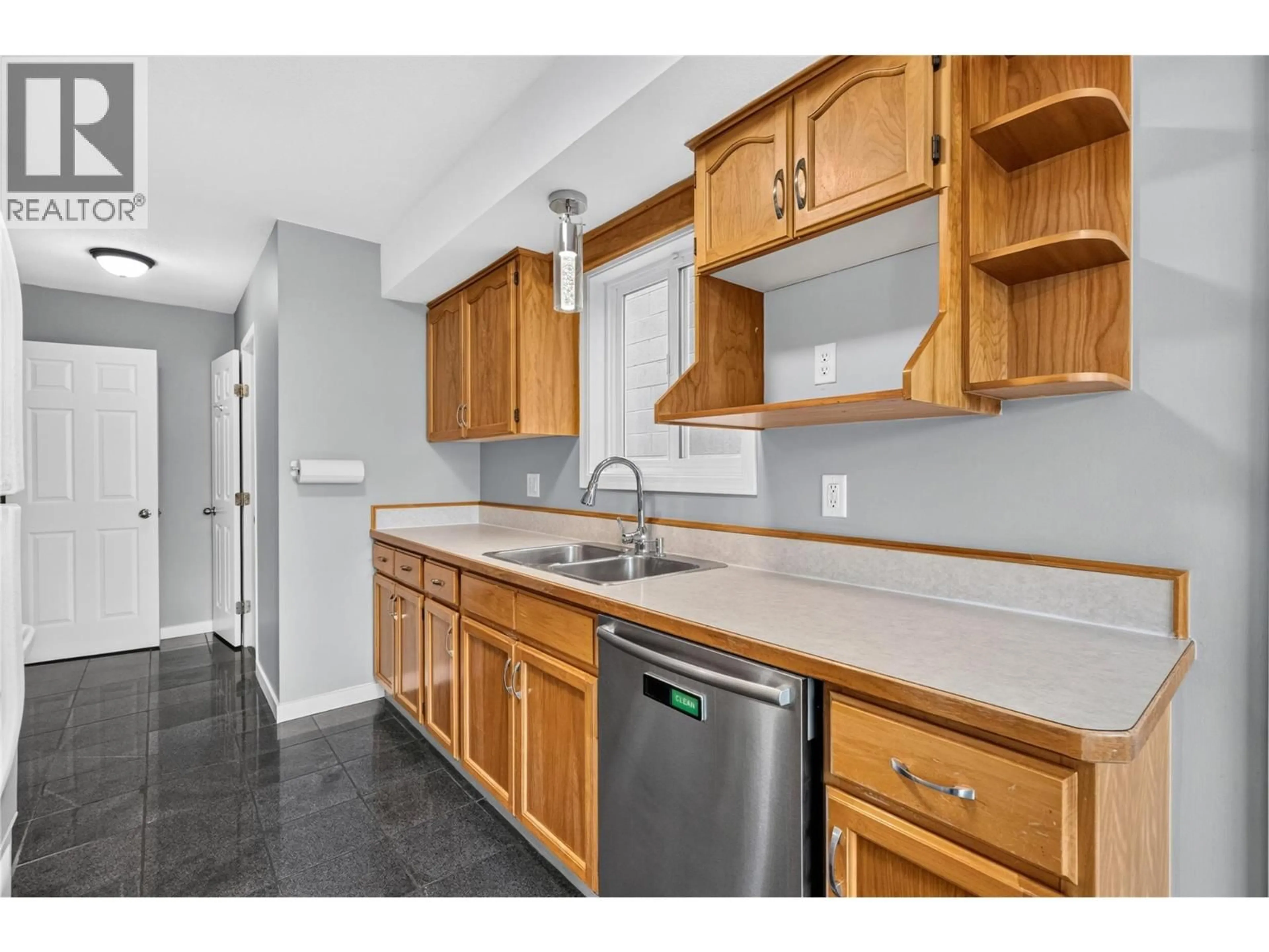 Standard kitchen, ceramic/tile floor for 101 - 460 RENE AVENUE, Penticton British Columbia V2A7M2
