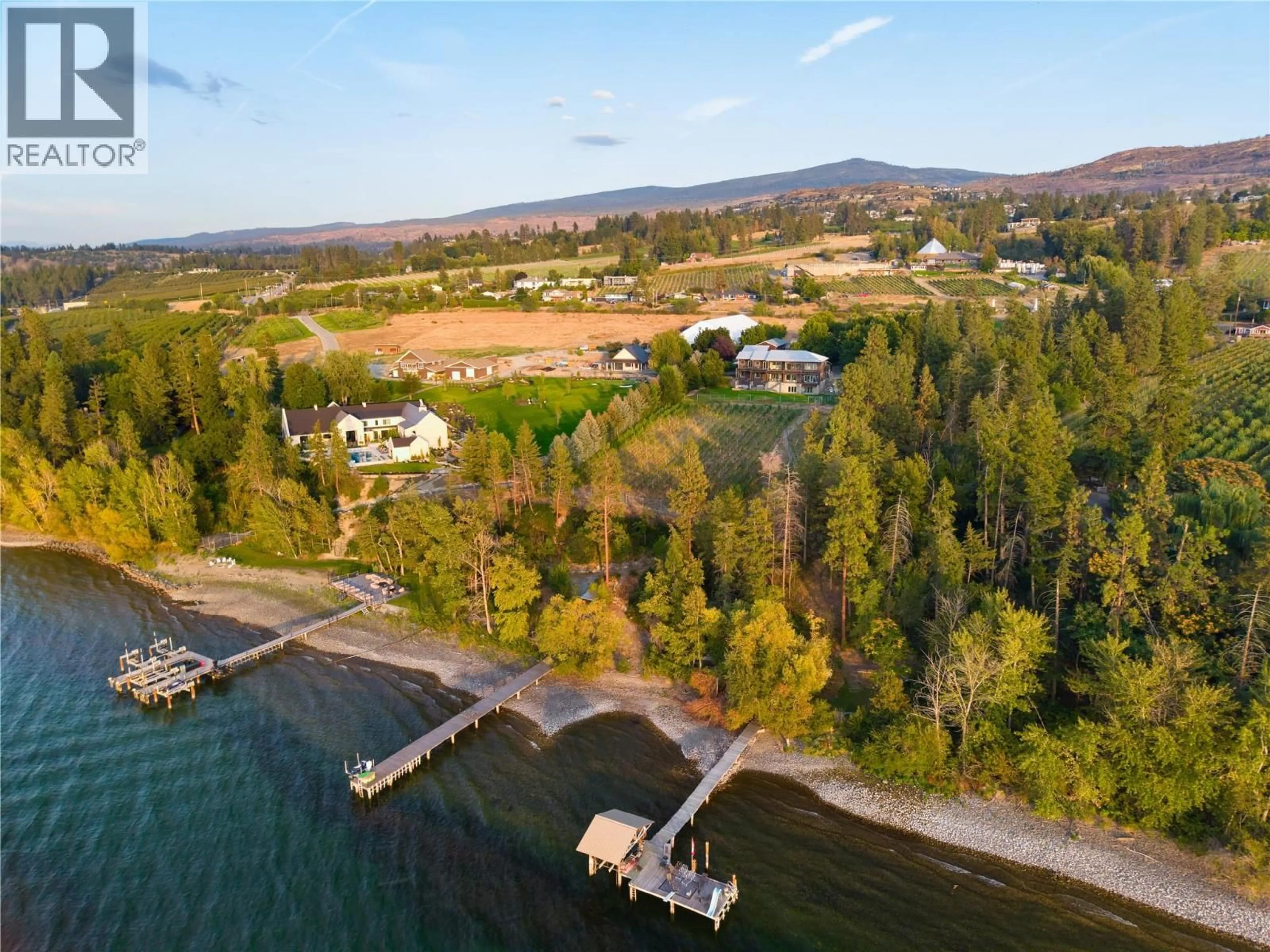 A pic from outside/outdoor area/front of a property/back of a property/a pic from drone, water/lake/river/ocean view for 4840 LAKESHORE ROAD, Kelowna British Columbia V1W4H6