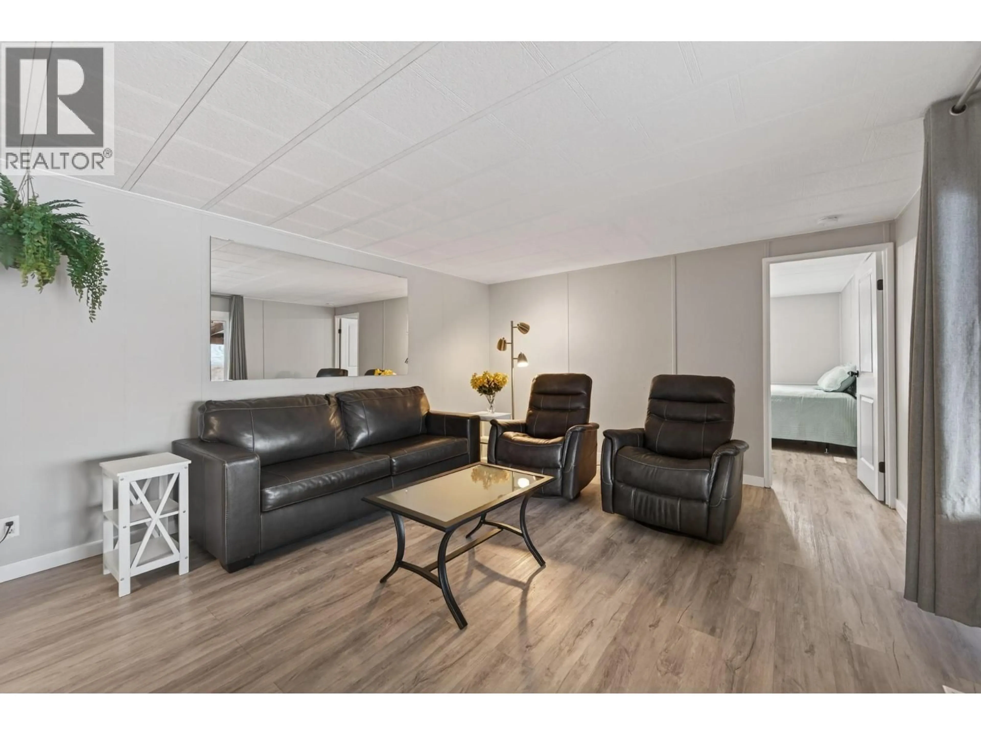 Living room with furniture, wood/laminate floor for #35 - 1680 WESTSYDE ROAD, Kamloops British Columbia V2B7B6