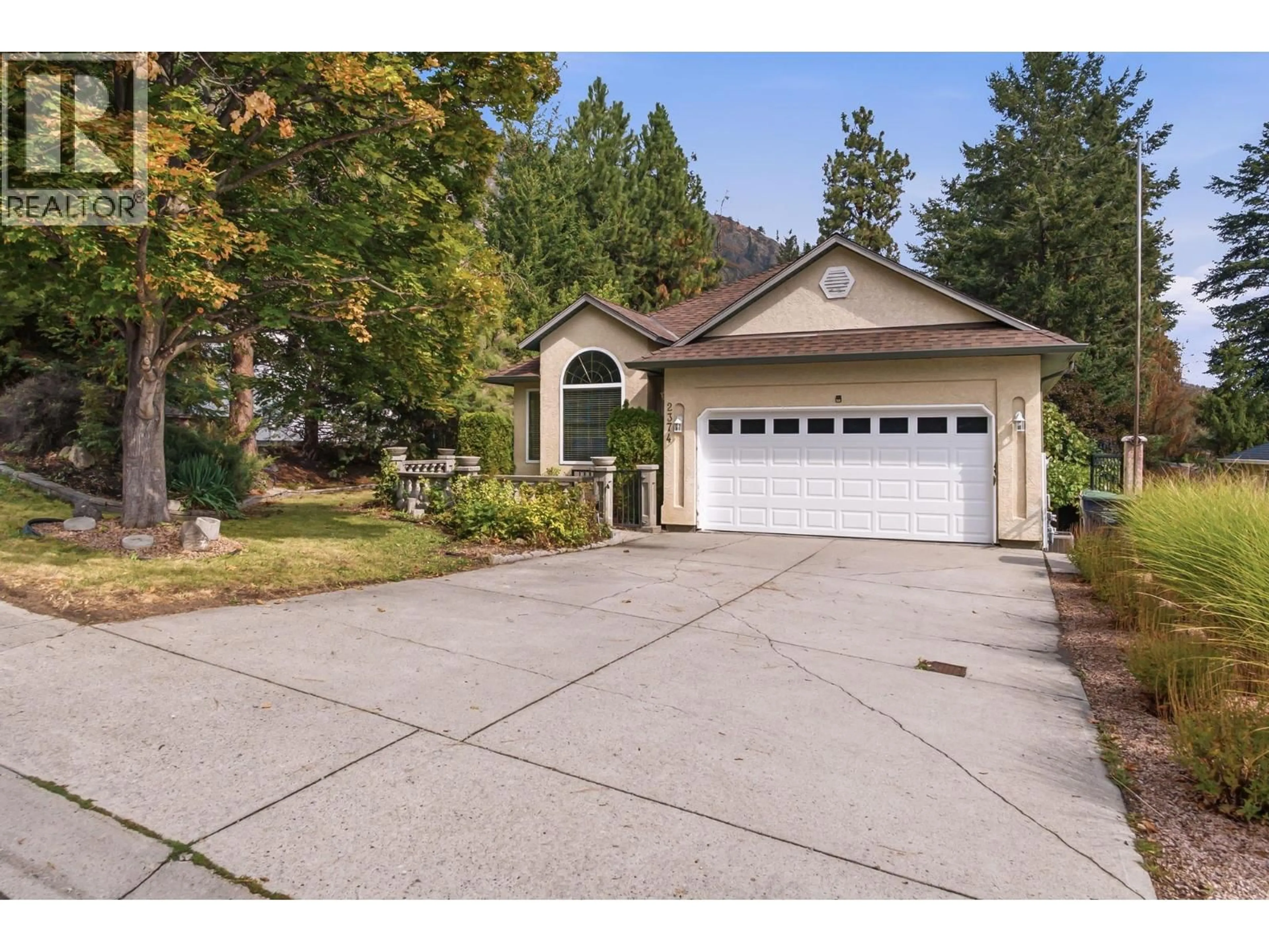 Home with vinyl exterior material, street for 2374 SHANNON WOODS DRIVE, West Kelowna British Columbia V4T2M1