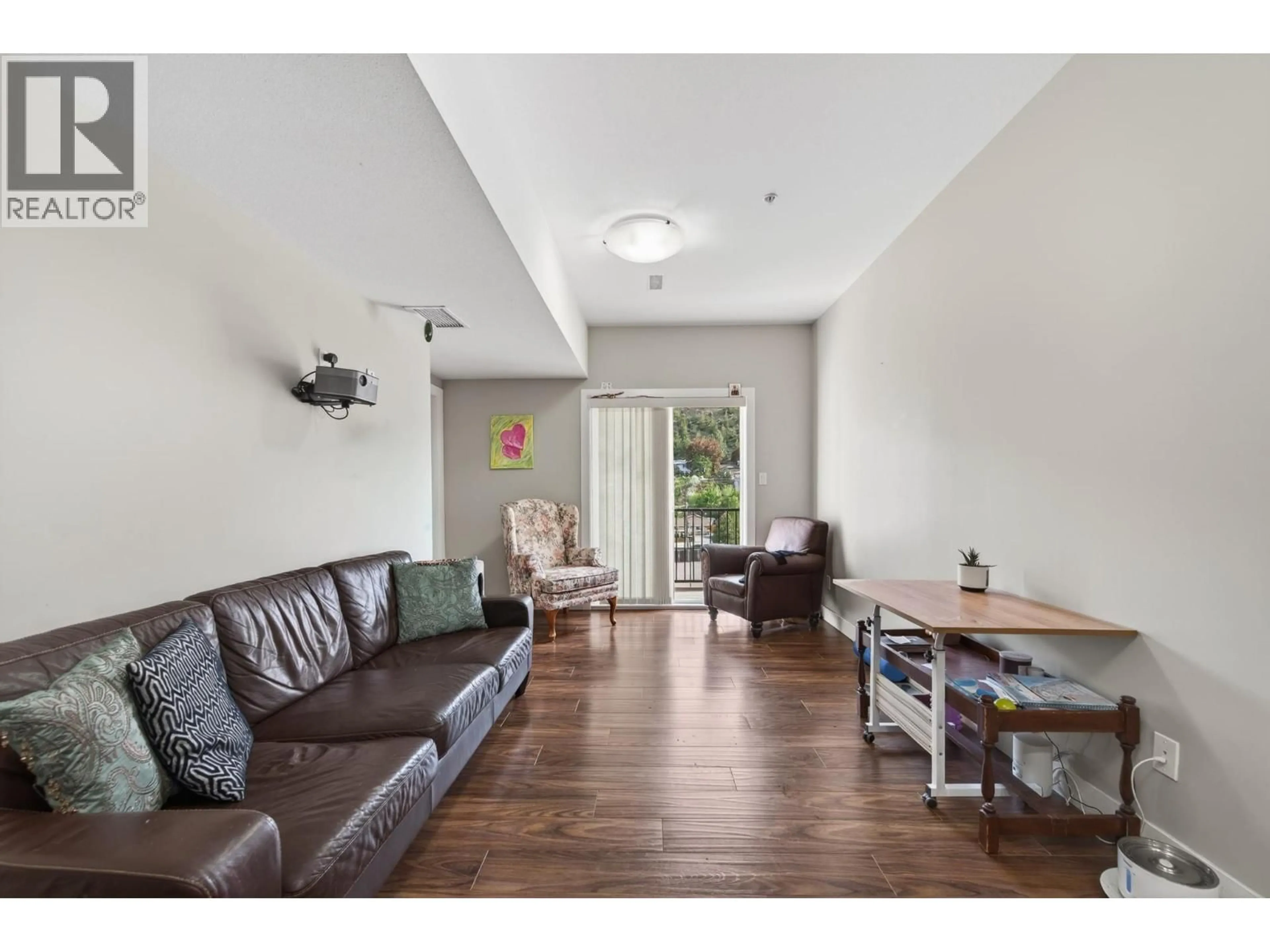 Living room with furniture, wood/laminate floor for 403 - 5170 DALLAS DRIVE, Kamloops British Columbia V2C0C7
