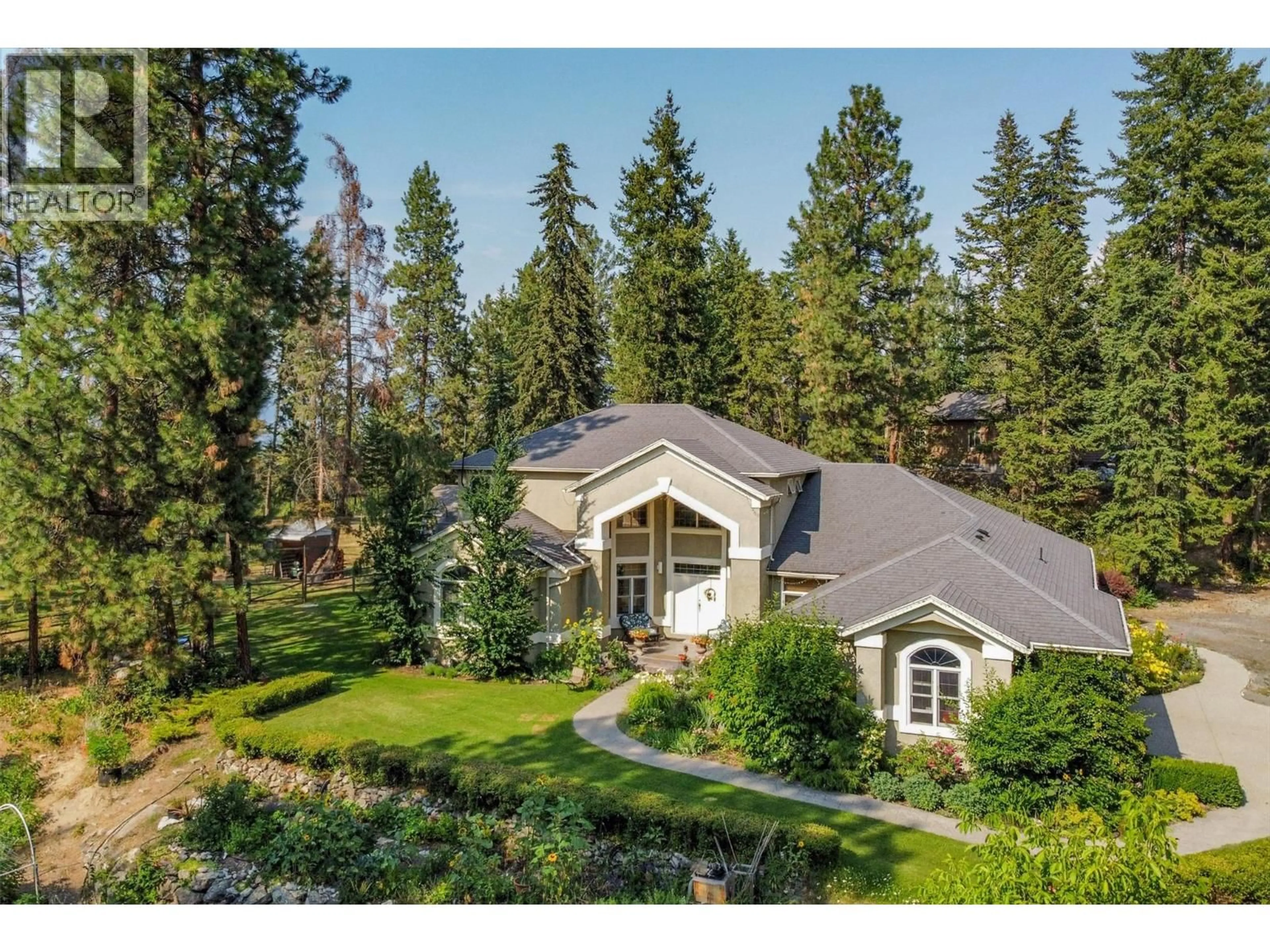 A pic from outside/outdoor area/front of a property/back of a property/a pic from drone, forest/trees view for 3605 LUXMOORE ROAD, Kelowna British Columbia V1W4C7