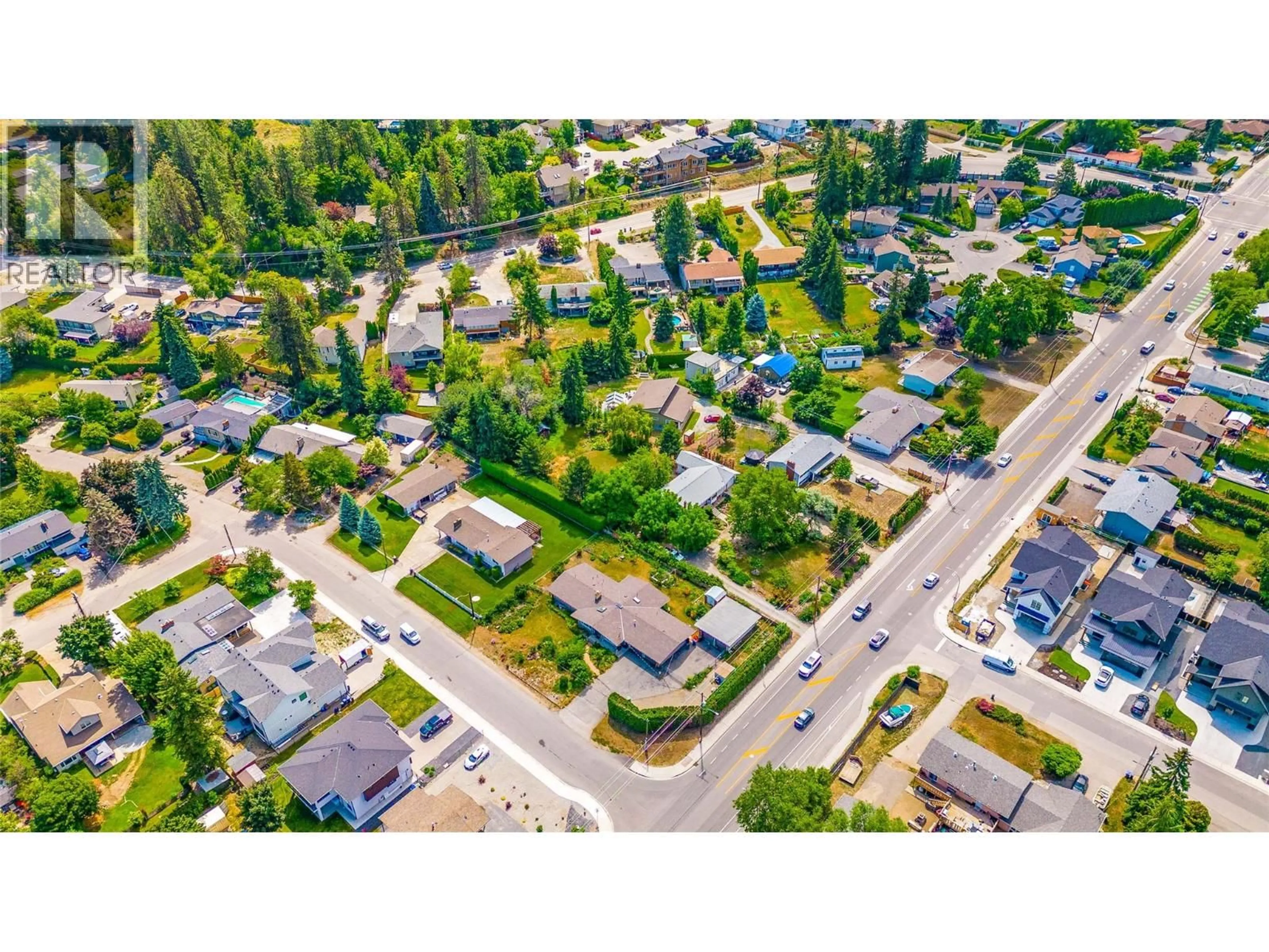 A pic from outside/outdoor area/front of a property/back of a property/a pic from drone, street for 705 HAZELL ROAD, Kelowna British Columbia V1W1R2