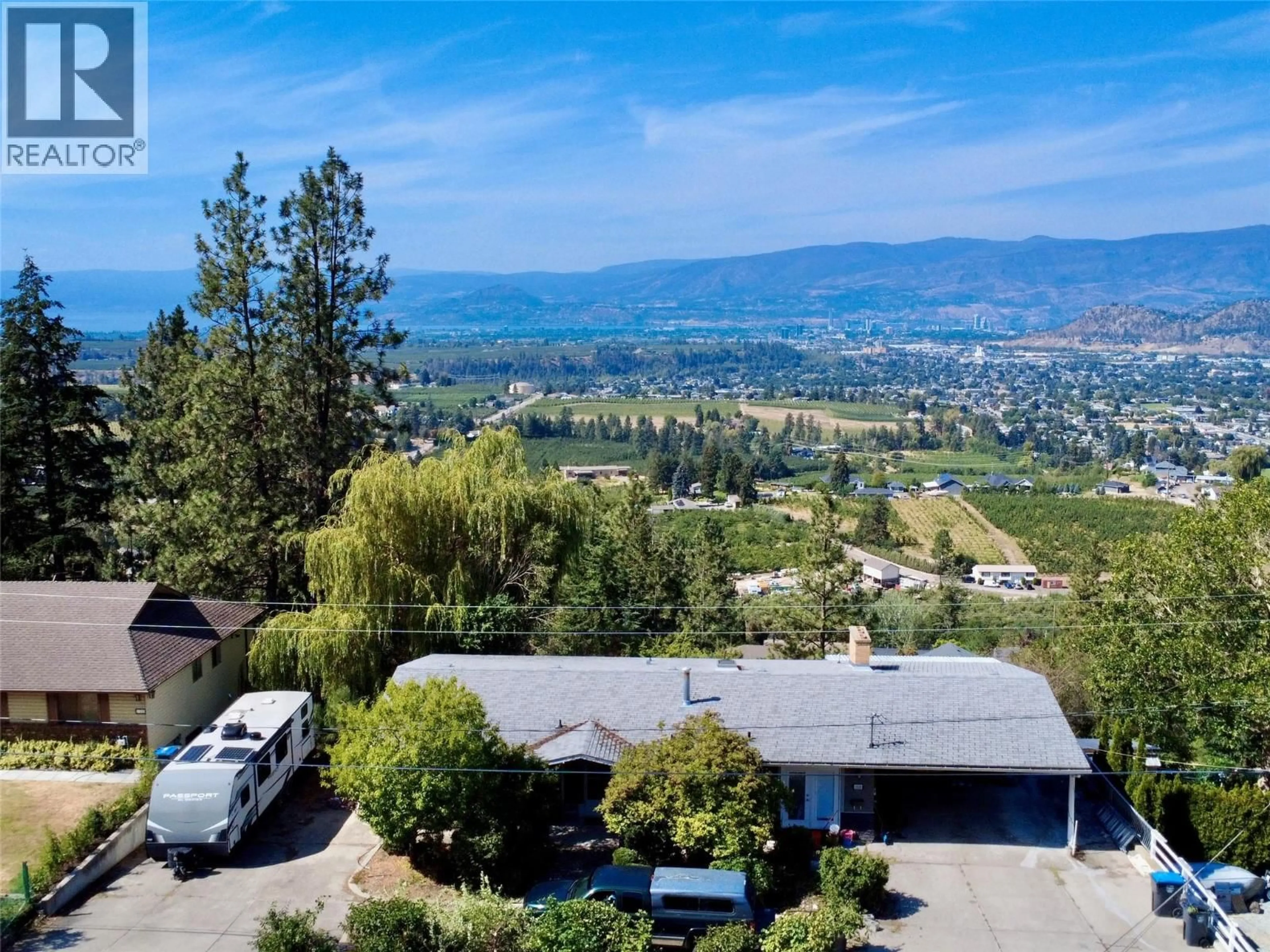 A pic from outside/outdoor area/front of a property/back of a property/a pic from drone, mountain view for 1030 TOOVEY ROAD, Kelowna British Columbia V1X6R1
