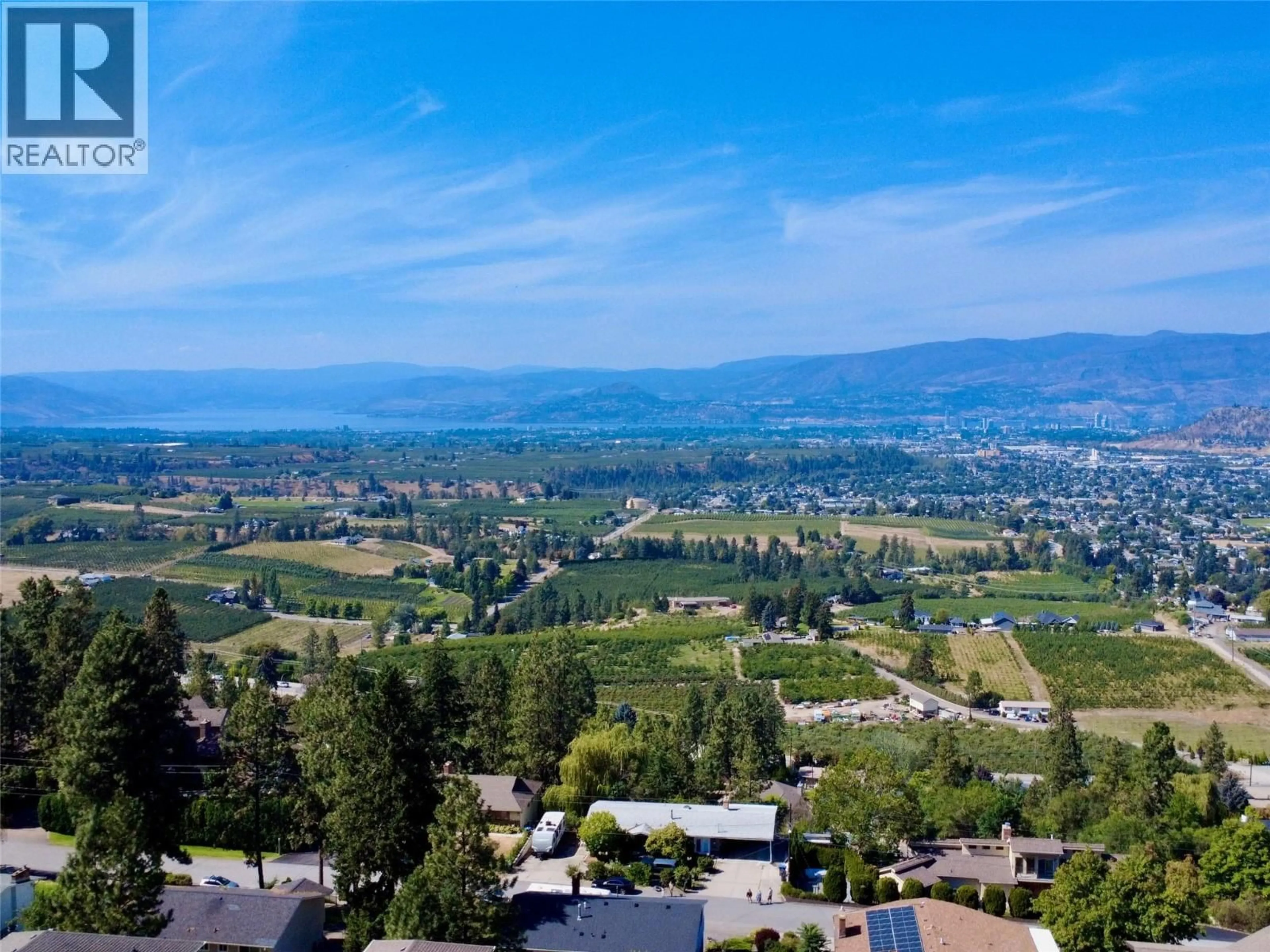 A pic from outside/outdoor area/front of a property/back of a property/a pic from drone, mountain view for 1030 TOOVEY ROAD, Kelowna British Columbia V1X6R1