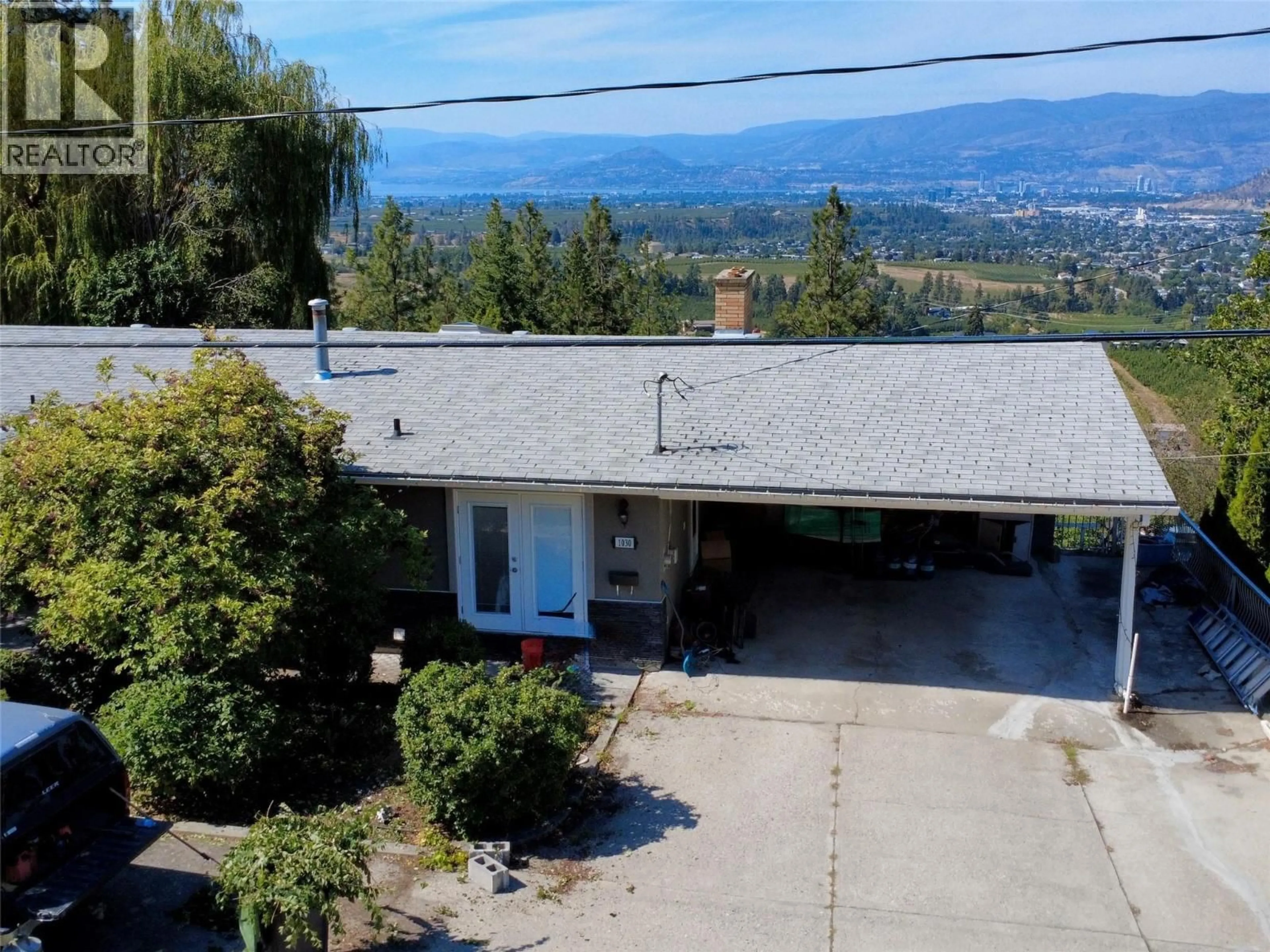 A pic from outside/outdoor area/front of a property/back of a property/a pic from drone, mountain view for 1030 TOOVEY ROAD, Kelowna British Columbia V1X6R1
