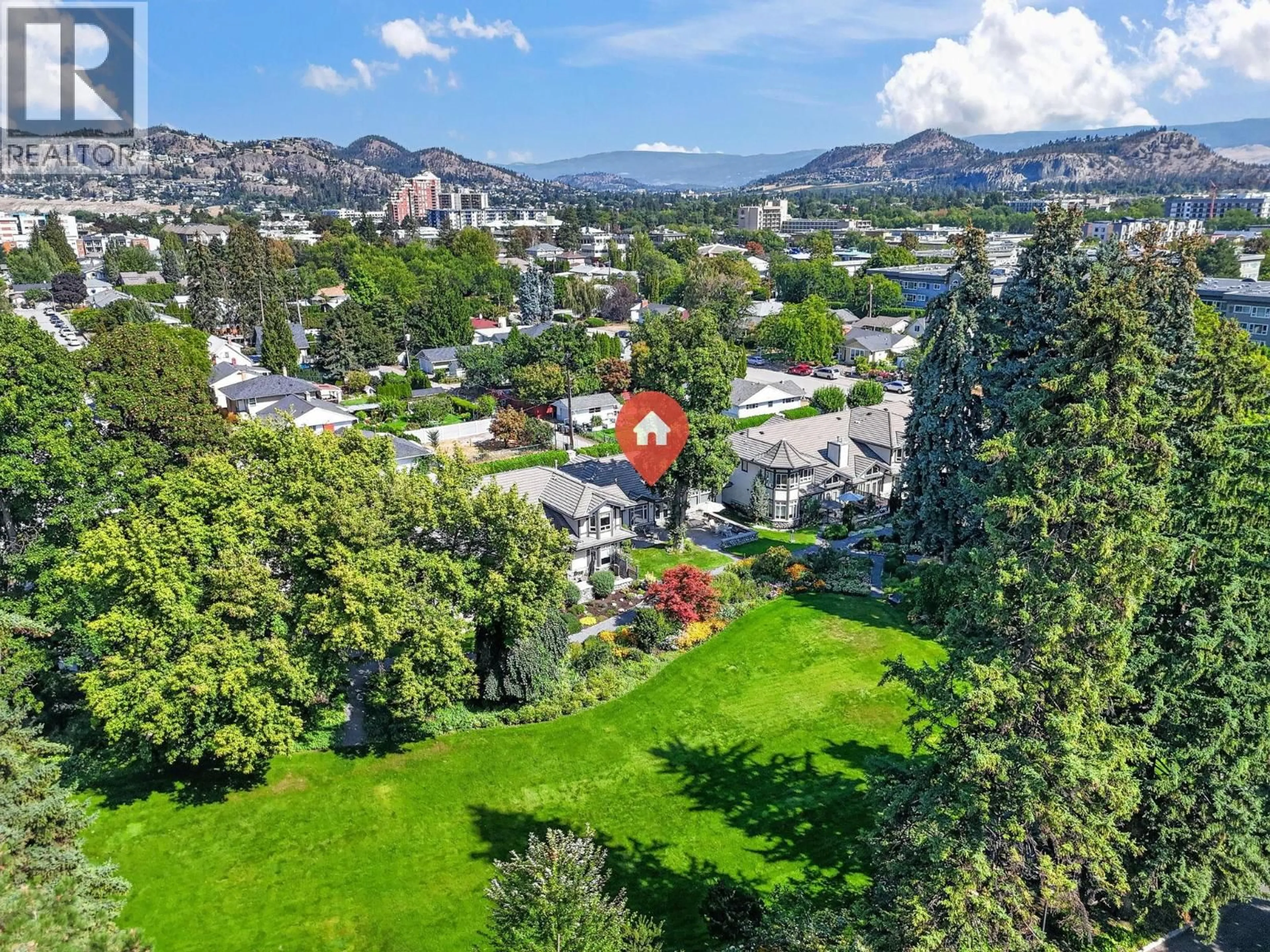 A pic from outside/outdoor area/front of a property/back of a property/a pic from drone, mountain view for 109 - 1986 BOWES STREET, Kelowna British Columbia V1Y3C3