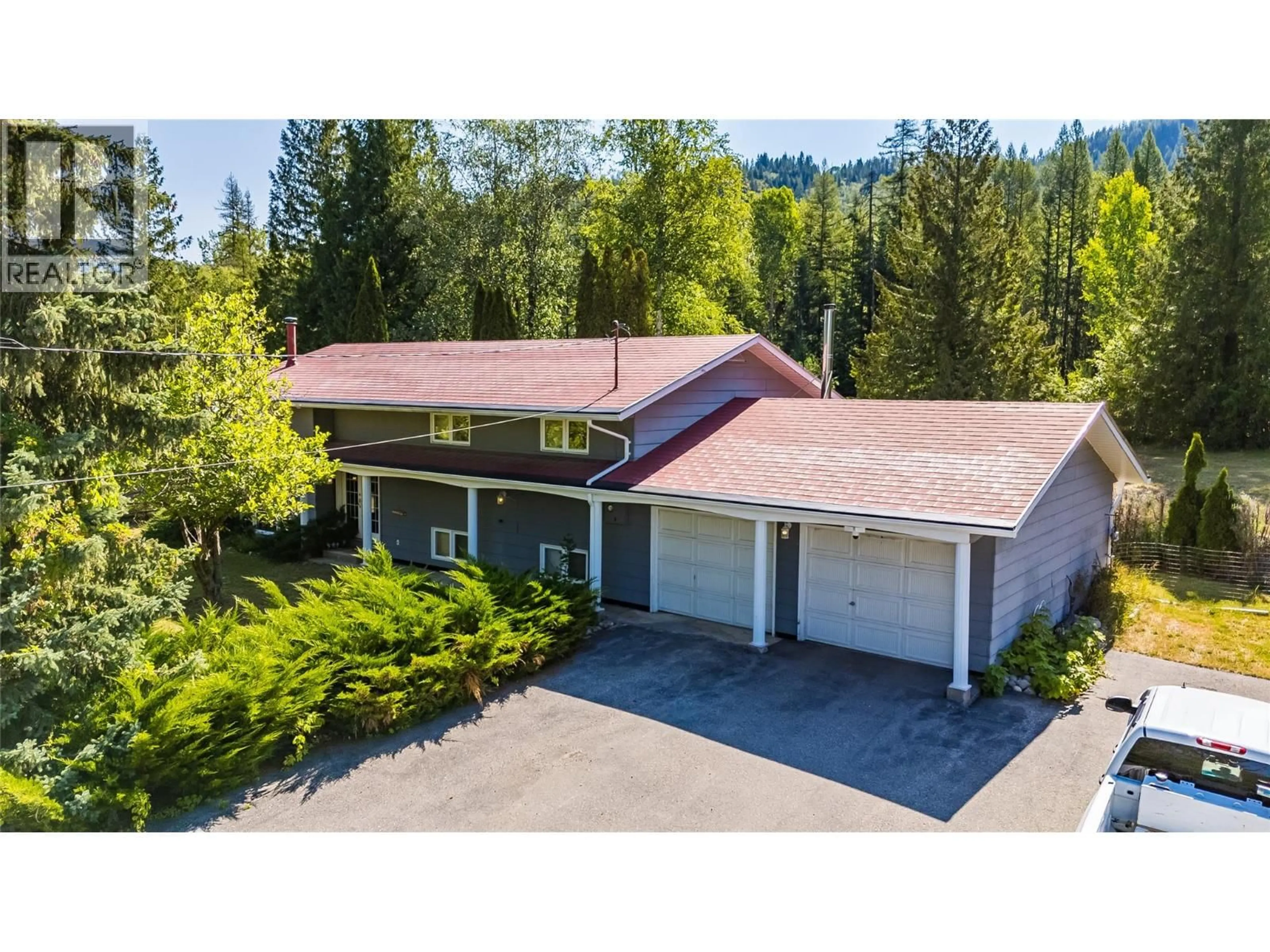 A pic from outside/outdoor area/front of a property/back of a property/a pic from drone, street for 1076 COLUMBIA GARDENS ROAD, Fruitvale British Columbia V0G1L1