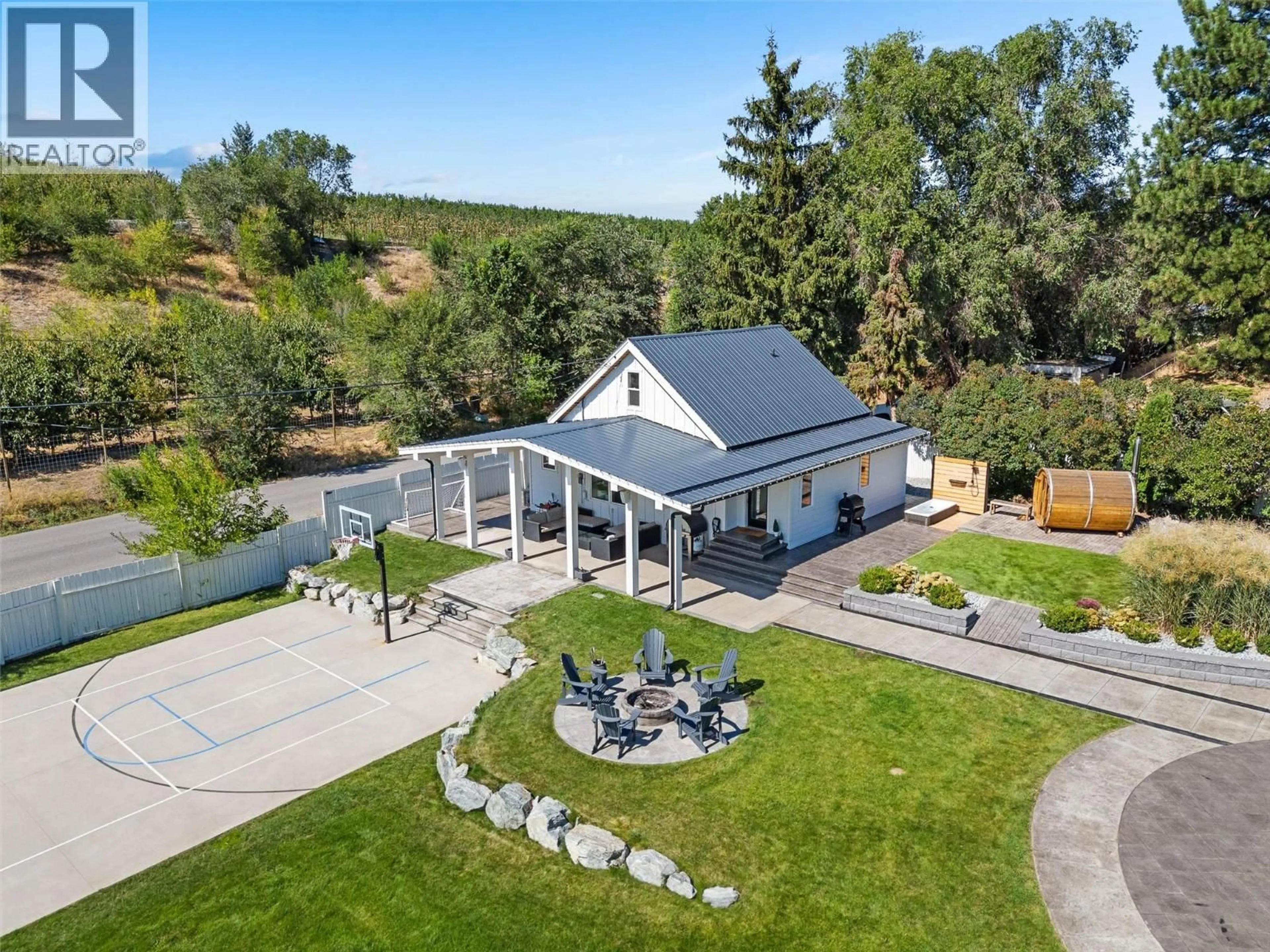 A pic from outside/outdoor area/front of a property/back of a property/a pic from drone, mountain view for 1456 LATTA ROAD, Kelowna British Columbia V1P1B4