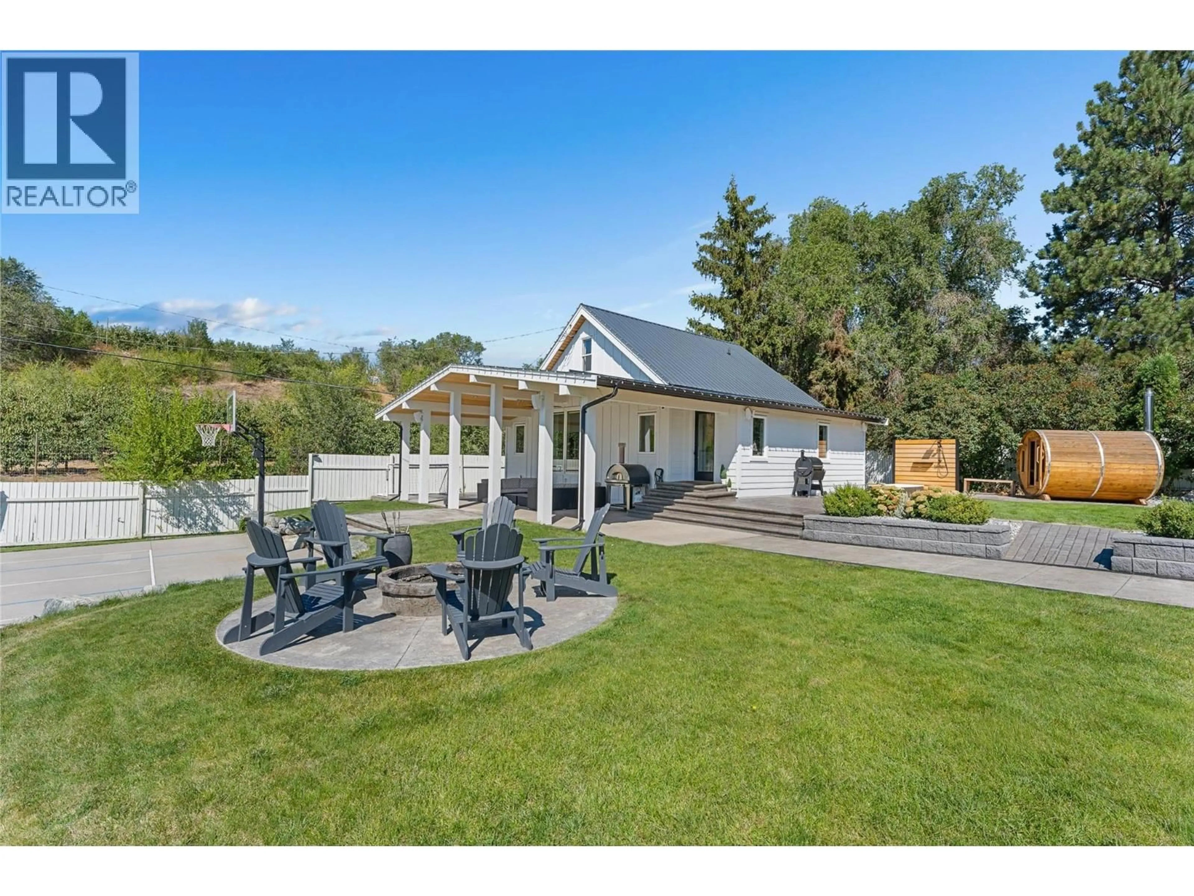 A pic from outside/outdoor area/front of a property/back of a property/a pic from drone, mountain view for 1456 LATTA ROAD, Kelowna British Columbia V1P1B4