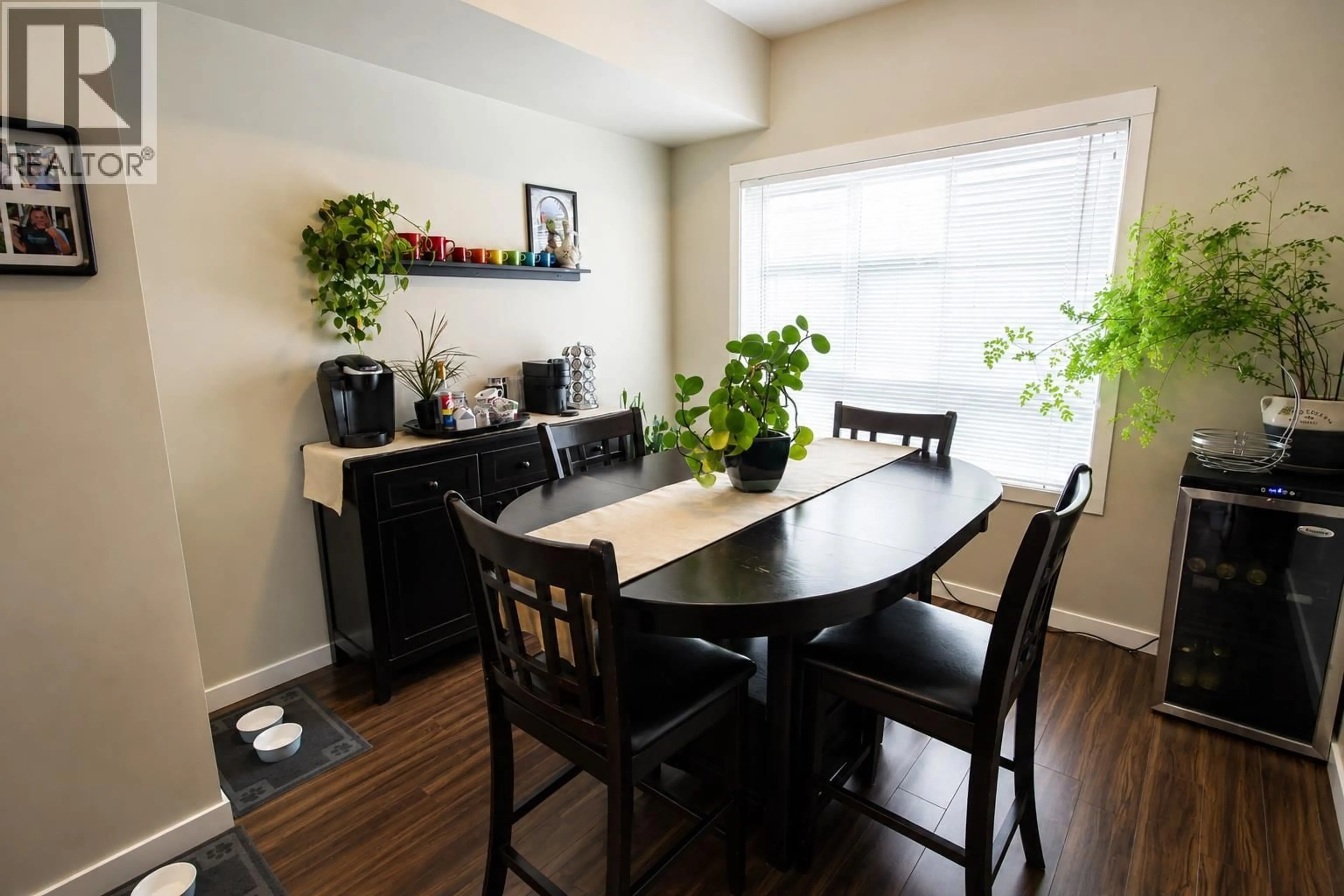 Dining room, wood/laminate floor for 85 - 680 OLD MEADOWS ROAD, Kelowna British Columbia V1W5L4