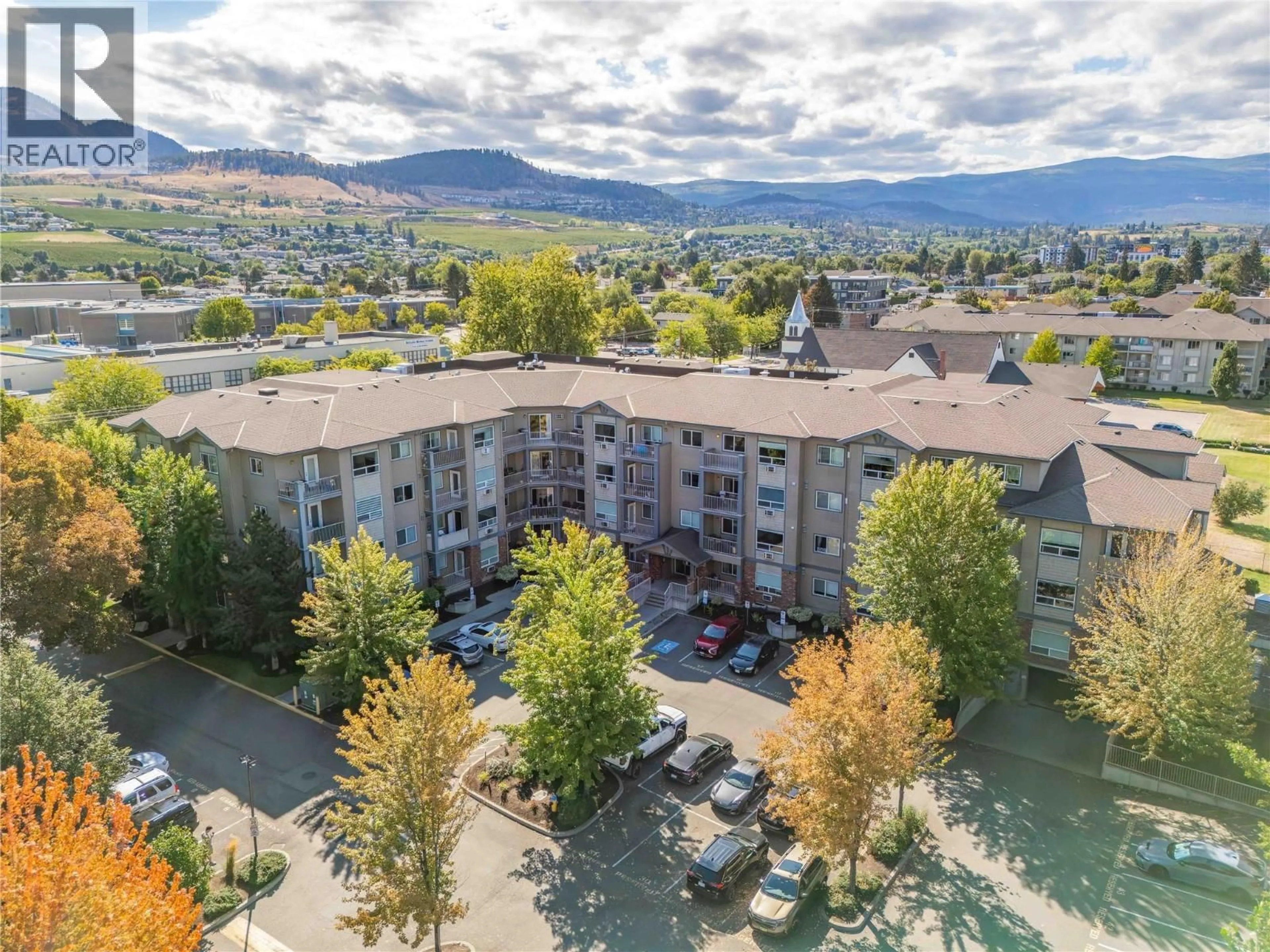 A pic from outside/outdoor area/front of a property/back of a property/a pic from drone, mountain view for 401 - 770 RUTLAND ROAD NORTH, Kelowna British Columbia V1X3B7