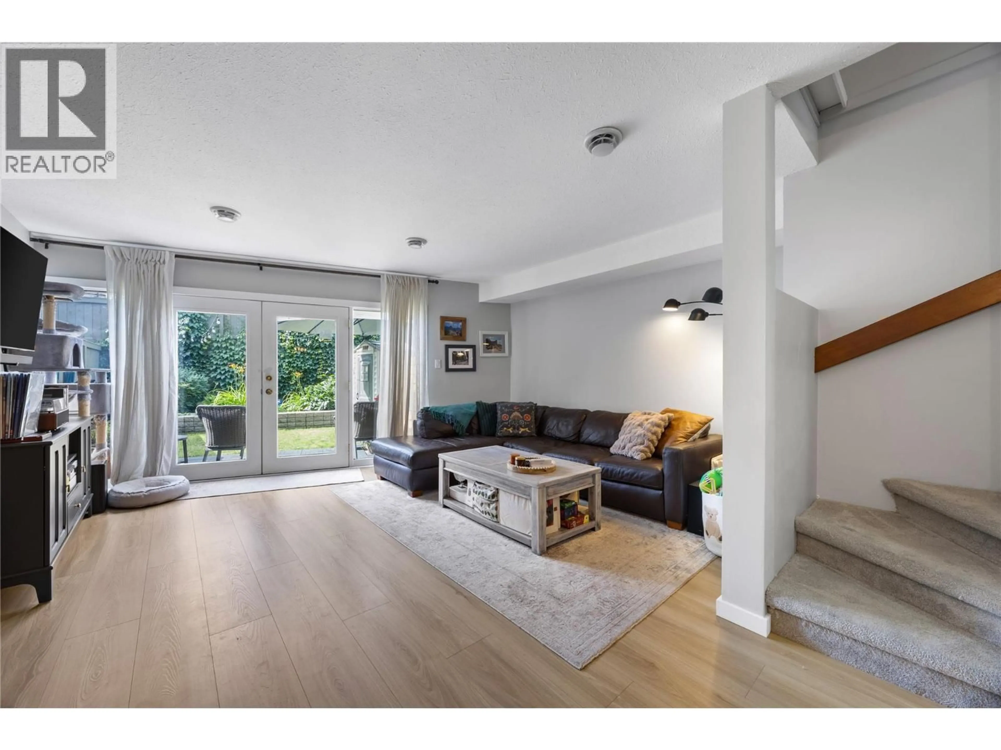 Living room with furniture, wood/laminate floor for 40 - 145 NICOLA STREET, Kamloops British Columbia V2C2P2