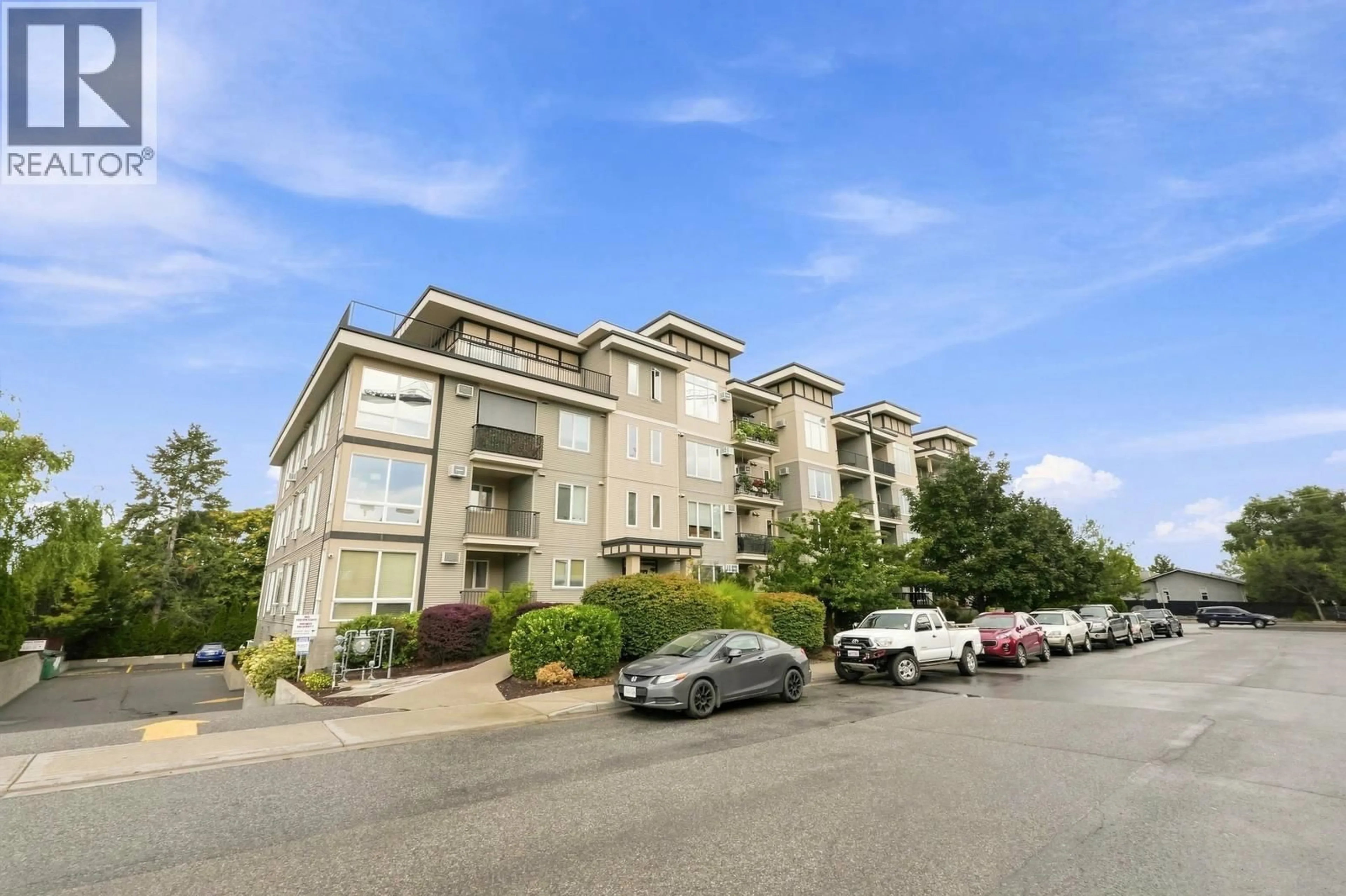 A pic from outside/outdoor area/front of a property/back of a property/a pic from drone, unknown for 102 - 130 BARBER ROAD, Kelowna British Columbia V1X3V4
