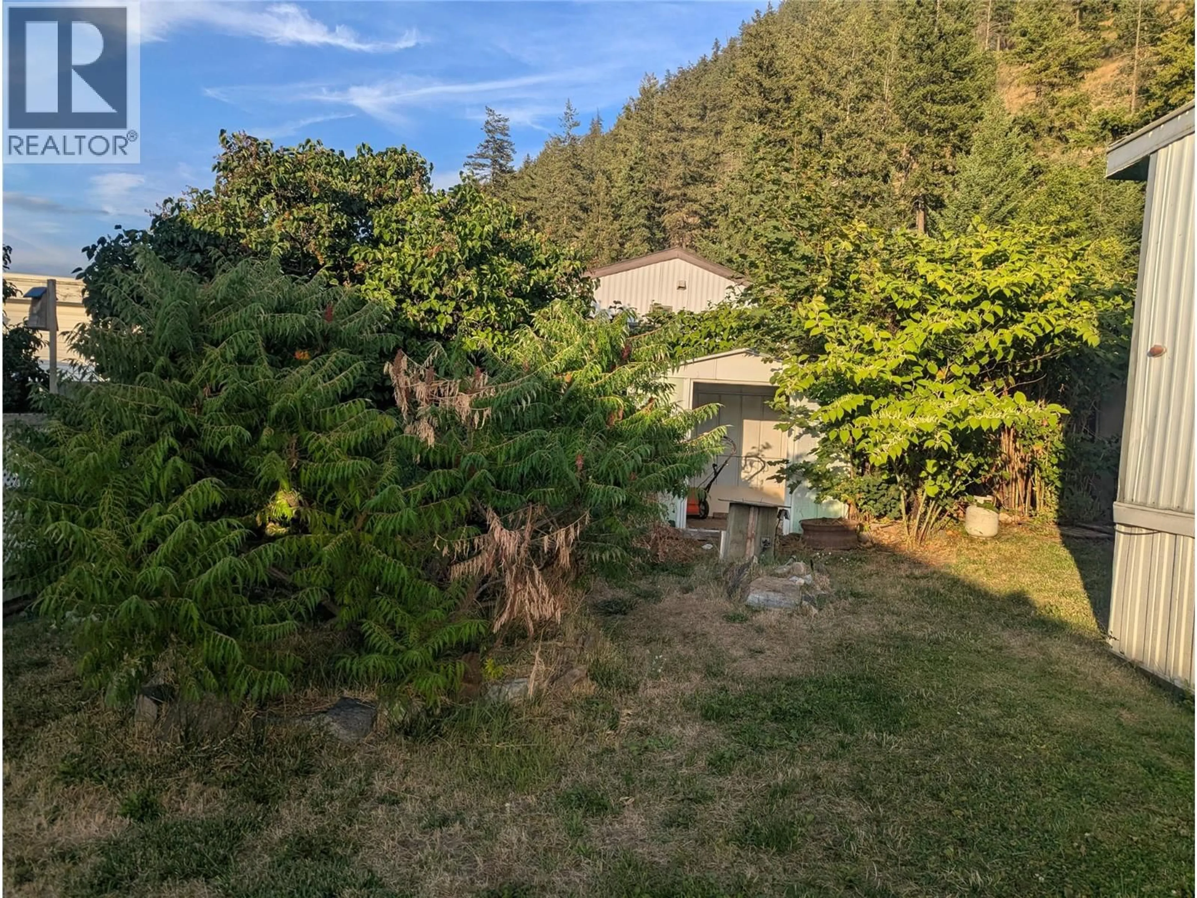 A pic from outside/outdoor area/front of a property/back of a property/a pic from drone, forest/trees view for 39 - 1214 OKANAGAN AVENUE, Chase British Columbia V0E1M0