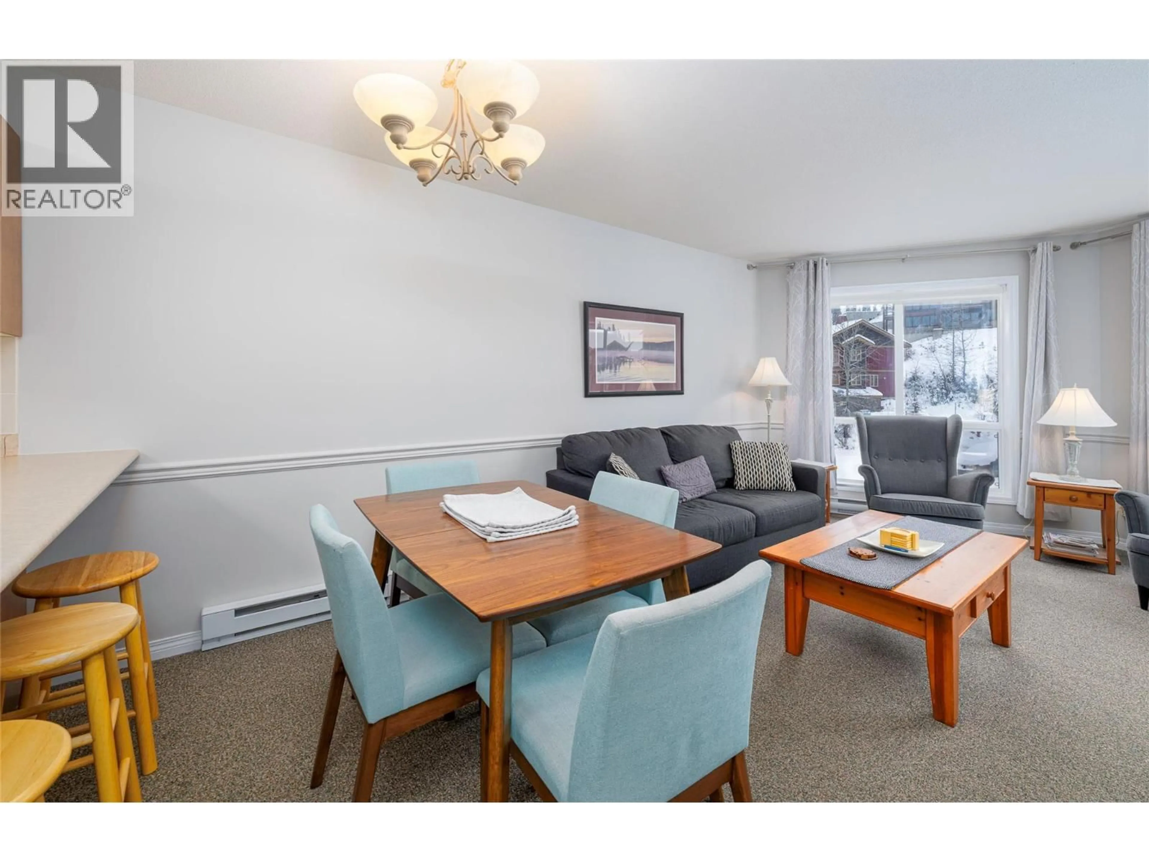 Living room with furniture, wood/laminate floor for 308 - 215 KETTLE VIEW ROAD, Big White British Columbia V1P1P3