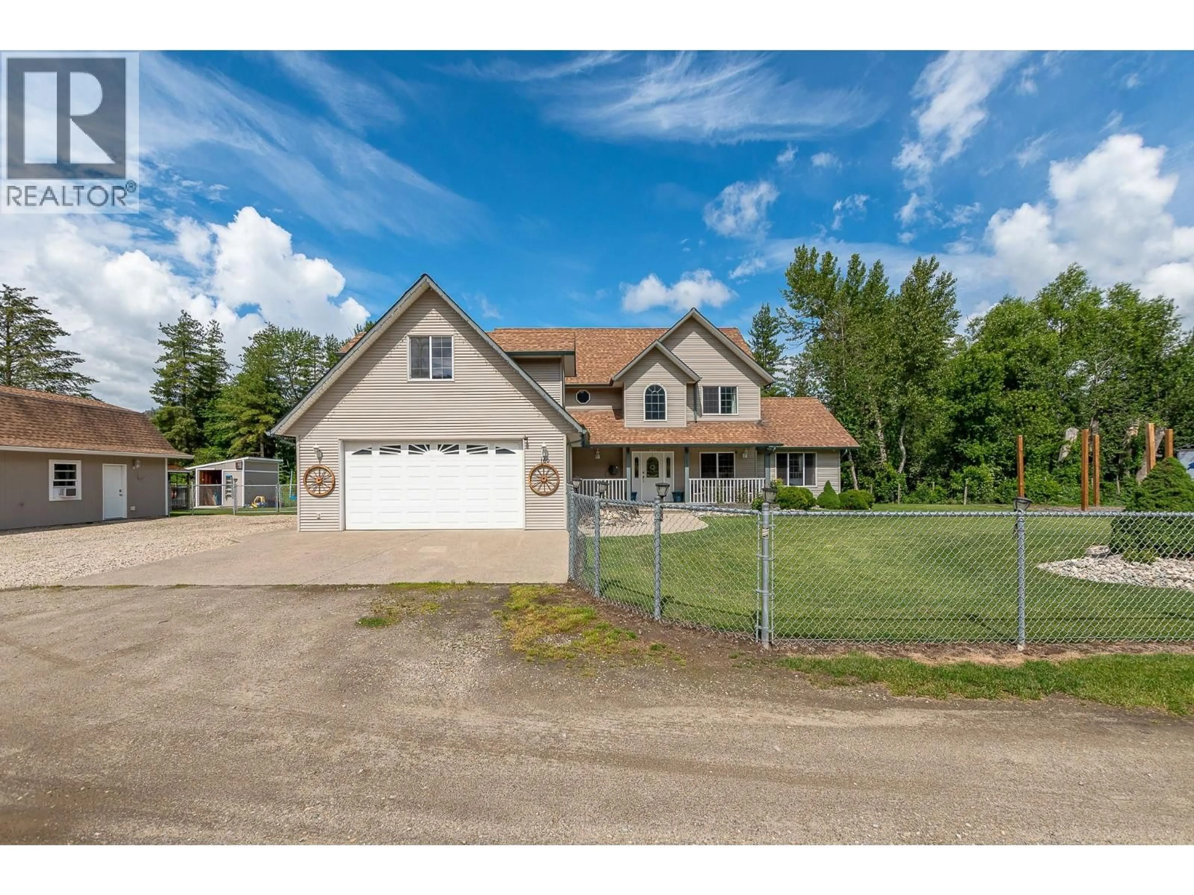 A pic from outside/outdoor area/front of a property/back of a property/a pic from drone, street for 160 CARLIN STREET, Grindrod British Columbia V0E1Y0