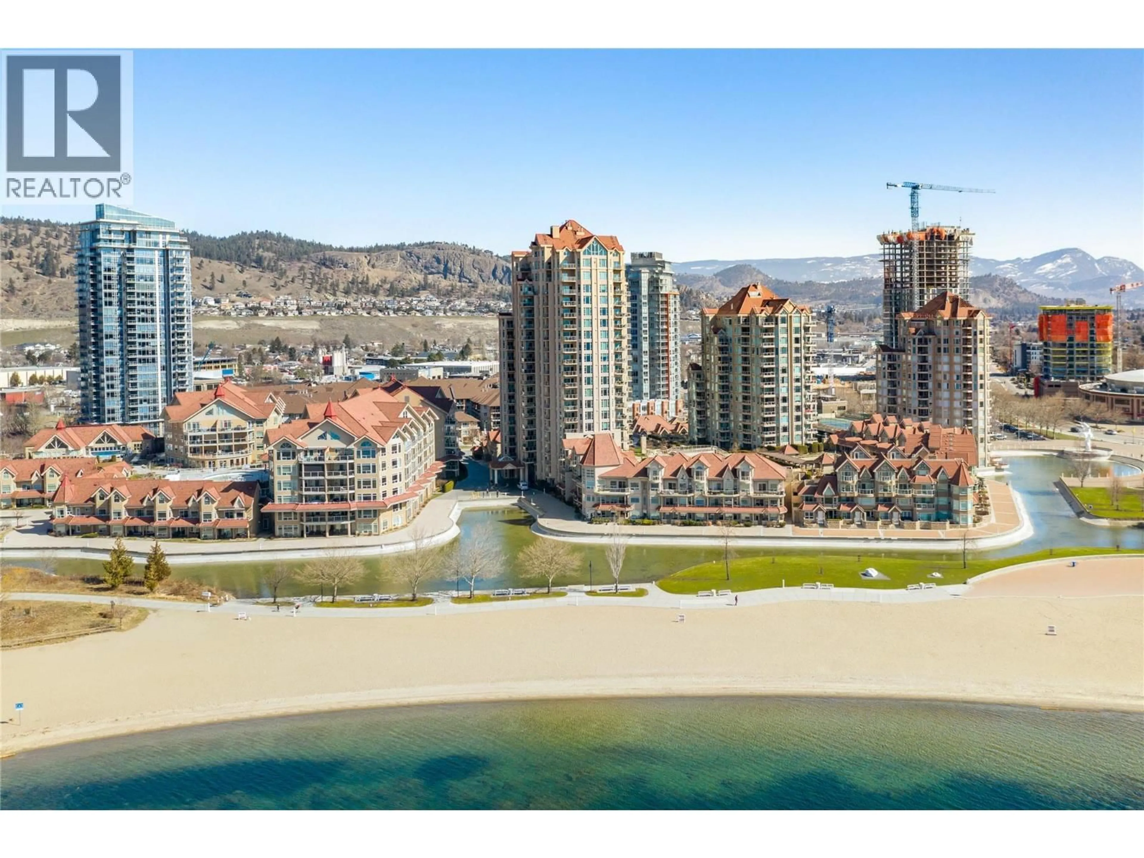 A pic from outside/outdoor area/front of a property/back of a property/a pic from drone, water/lake/river/ocean view for 427 - 1088 SUNSET DRIVE, Kelowna British Columbia V1Y9W1