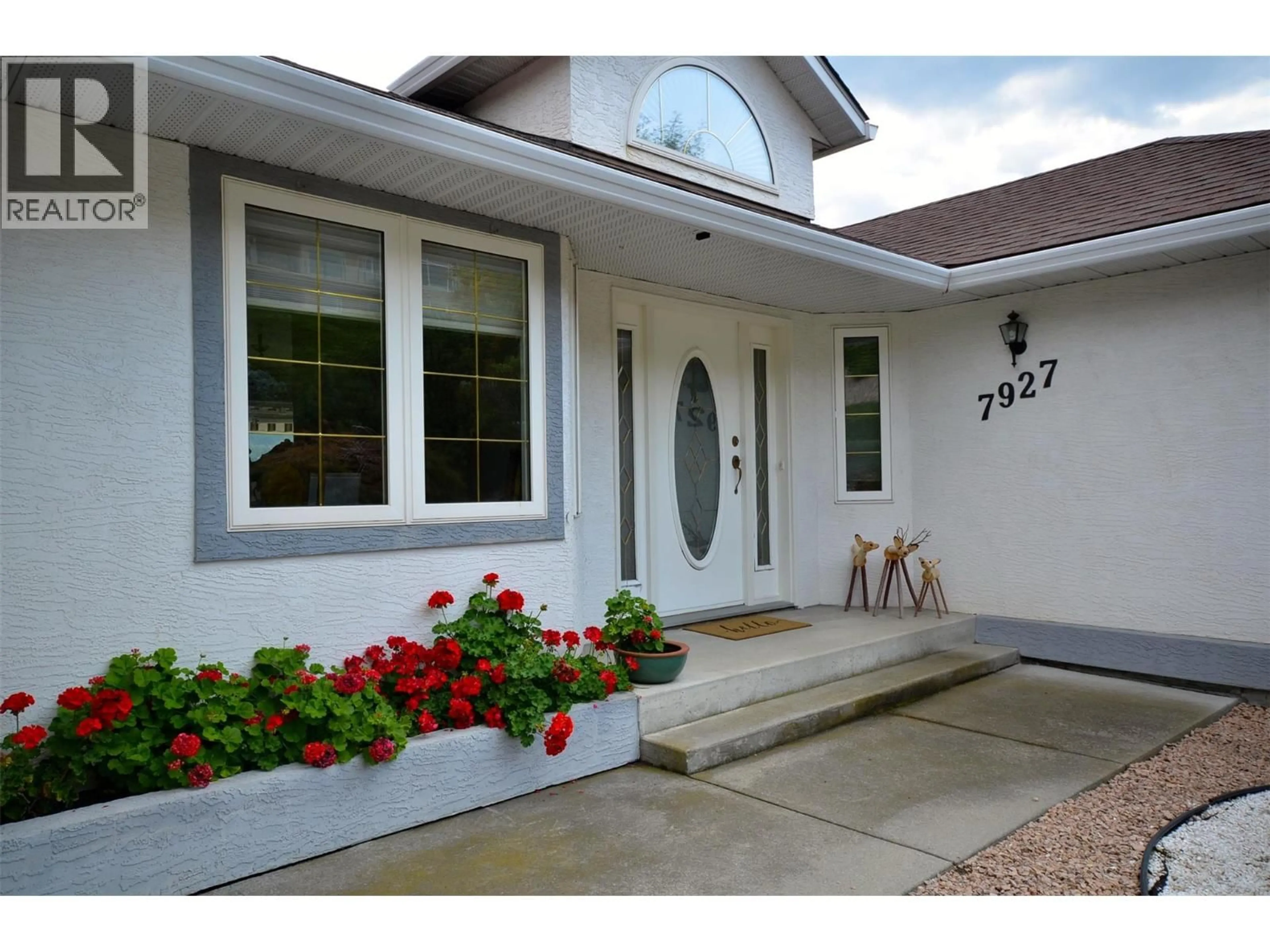 Home with vinyl exterior material, street for 7927 STONERIDGE DRIVE, Coldstream British Columbia V1B2T7