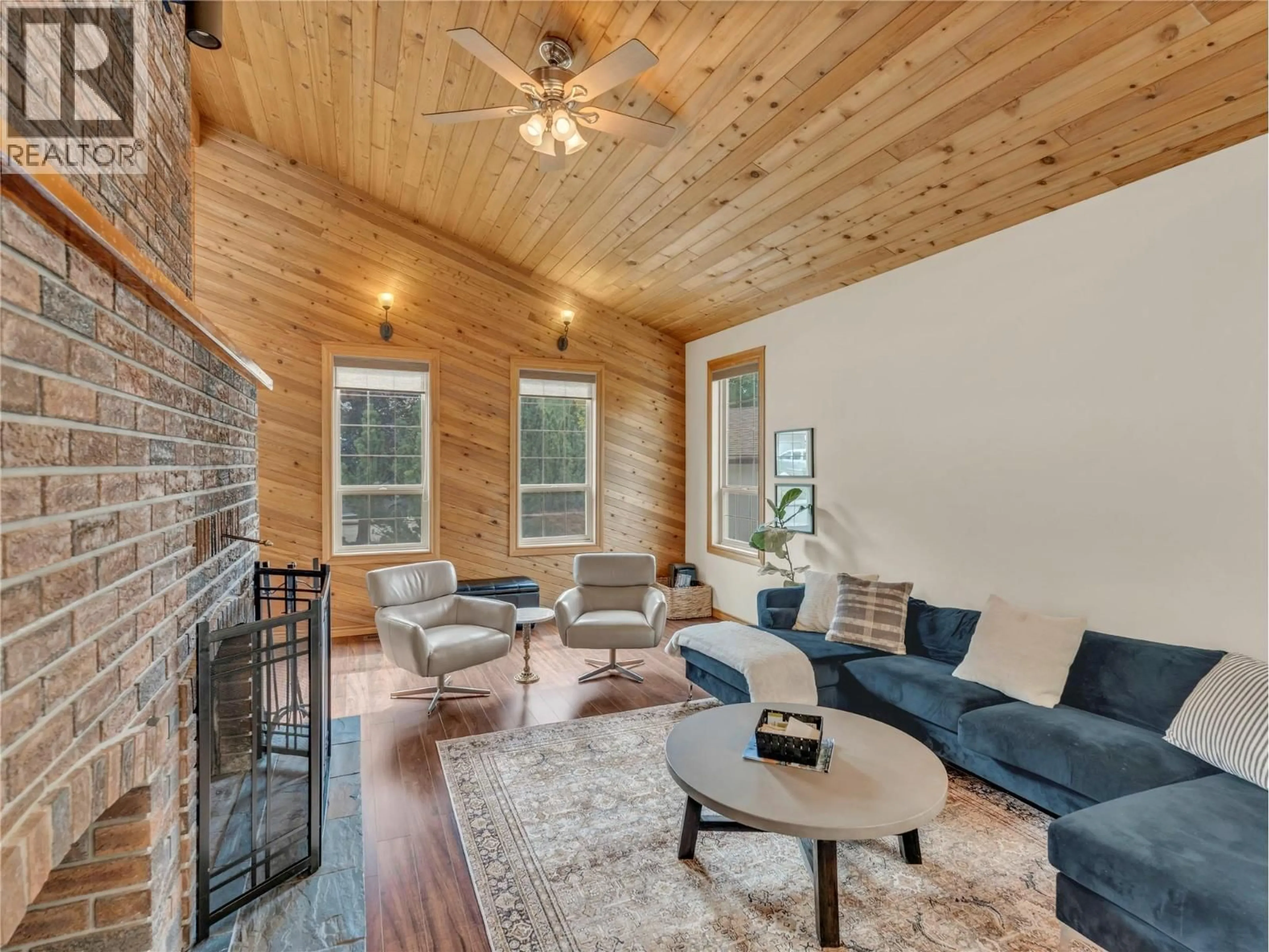Living room with furniture, wood/laminate floor for 157 ADAMS CRESCENT, Penticton British Columbia V2A7B6