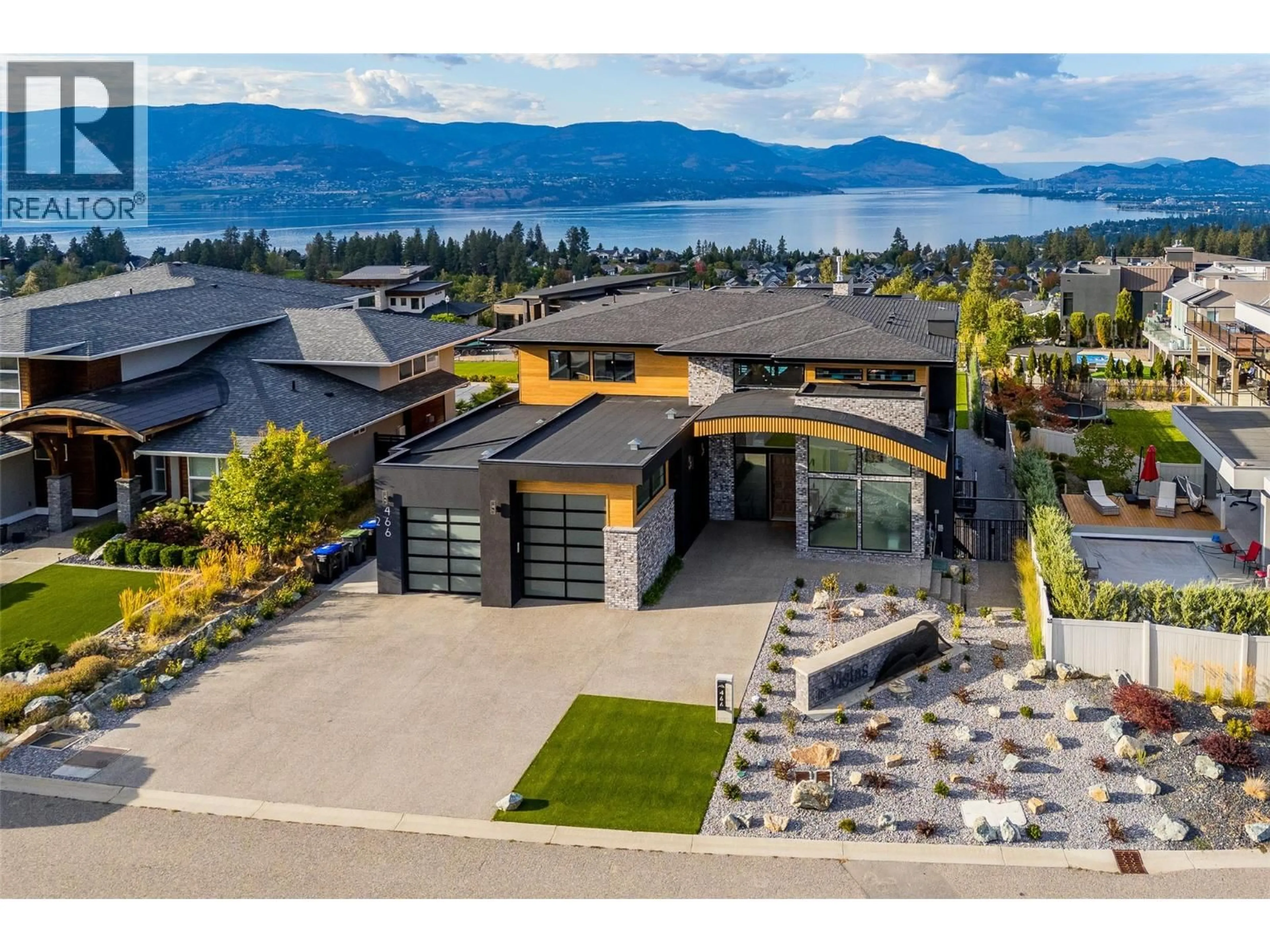 A pic from outside/outdoor area/front of a property/back of a property/a pic from drone, mountain view for 466 SWAN DRIVE, Kelowna British Columbia V1W5L9