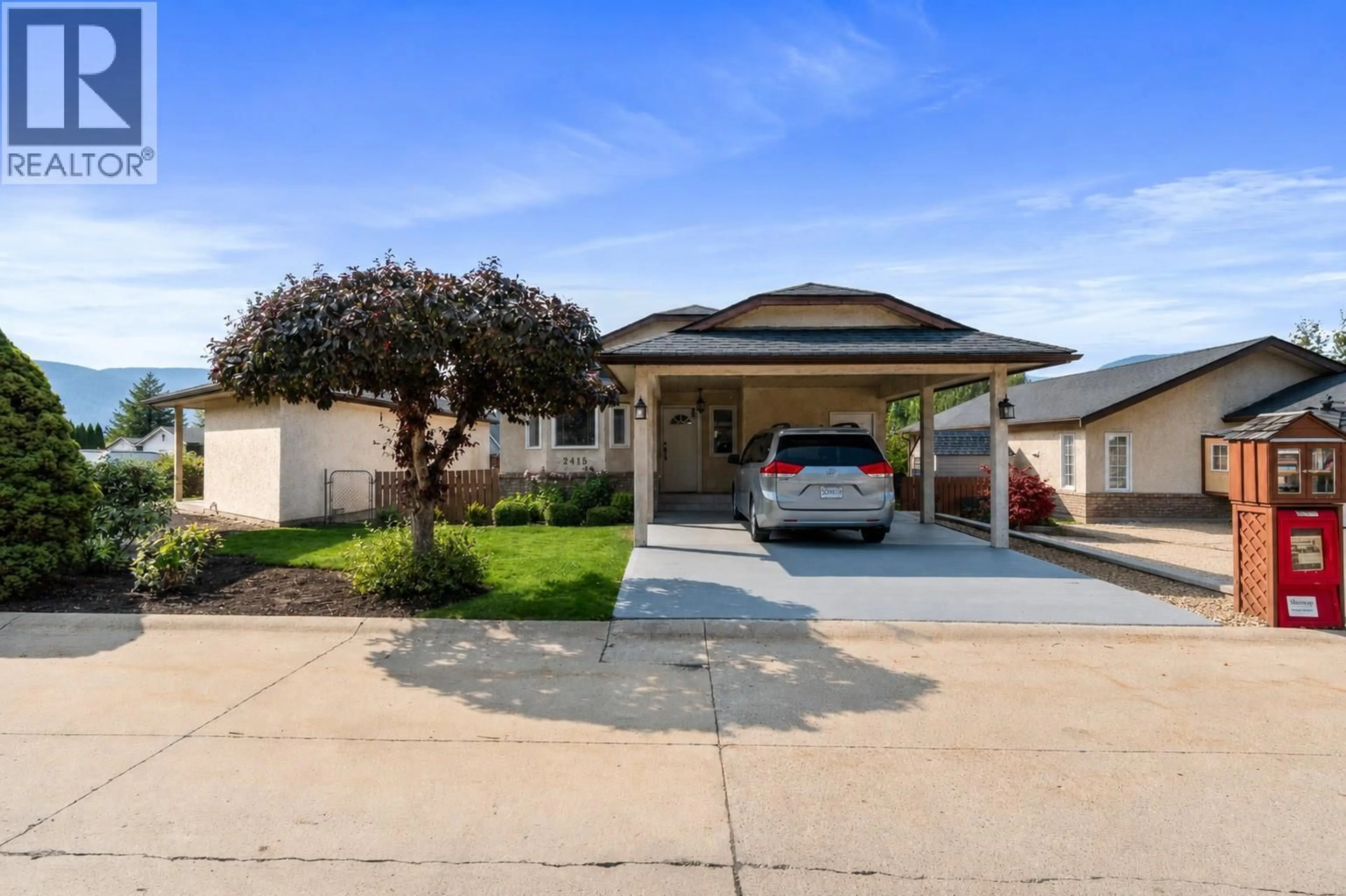 Home with vinyl exterior material, street for 2415 5 AVENUE NORTHEAST, Salmon Arm British Columbia V1E1Y9