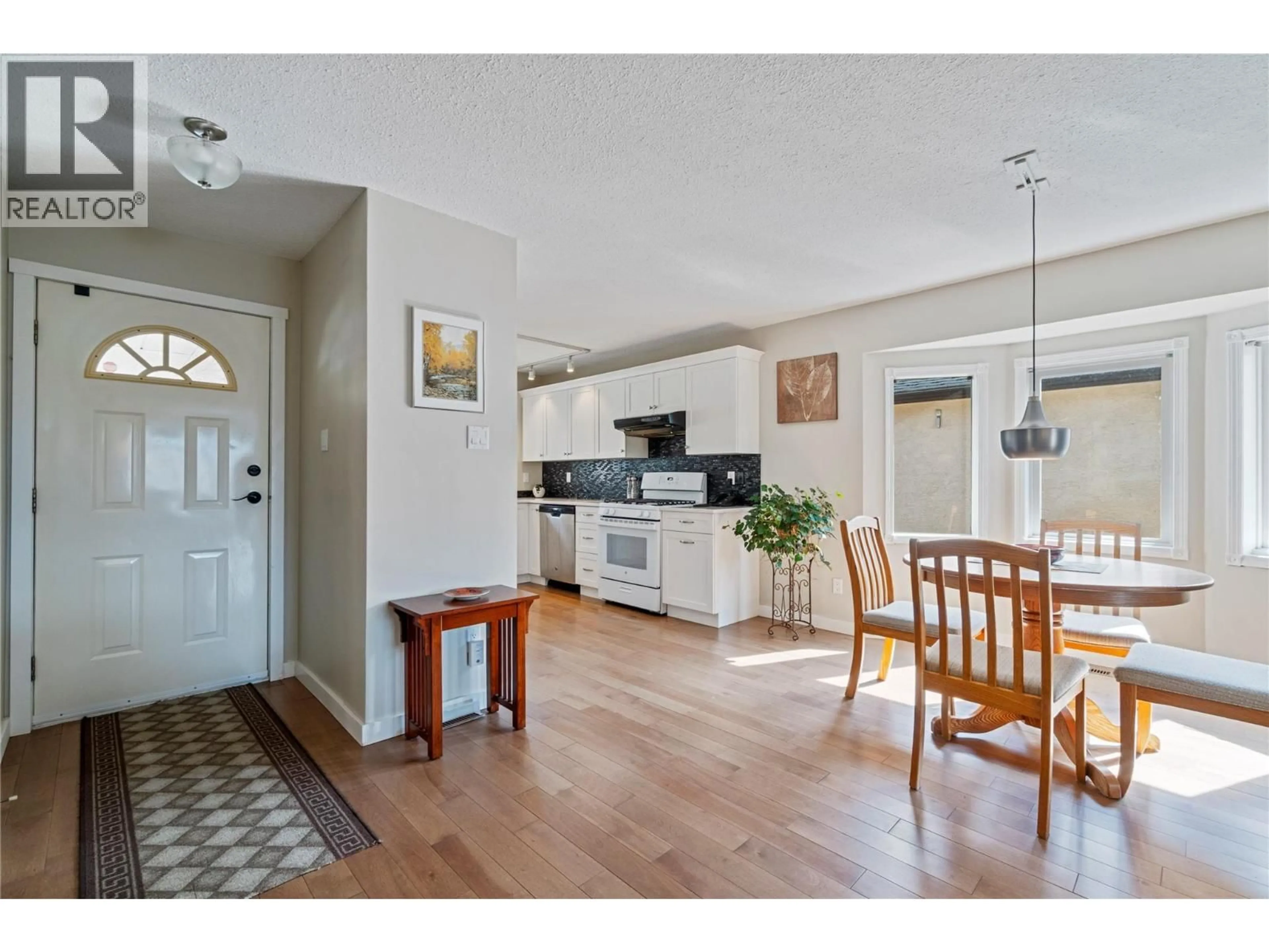 Open concept kitchen, ceramic/tile floor for 2415 5 AVENUE NORTHEAST, Salmon Arm British Columbia V1E1Y9