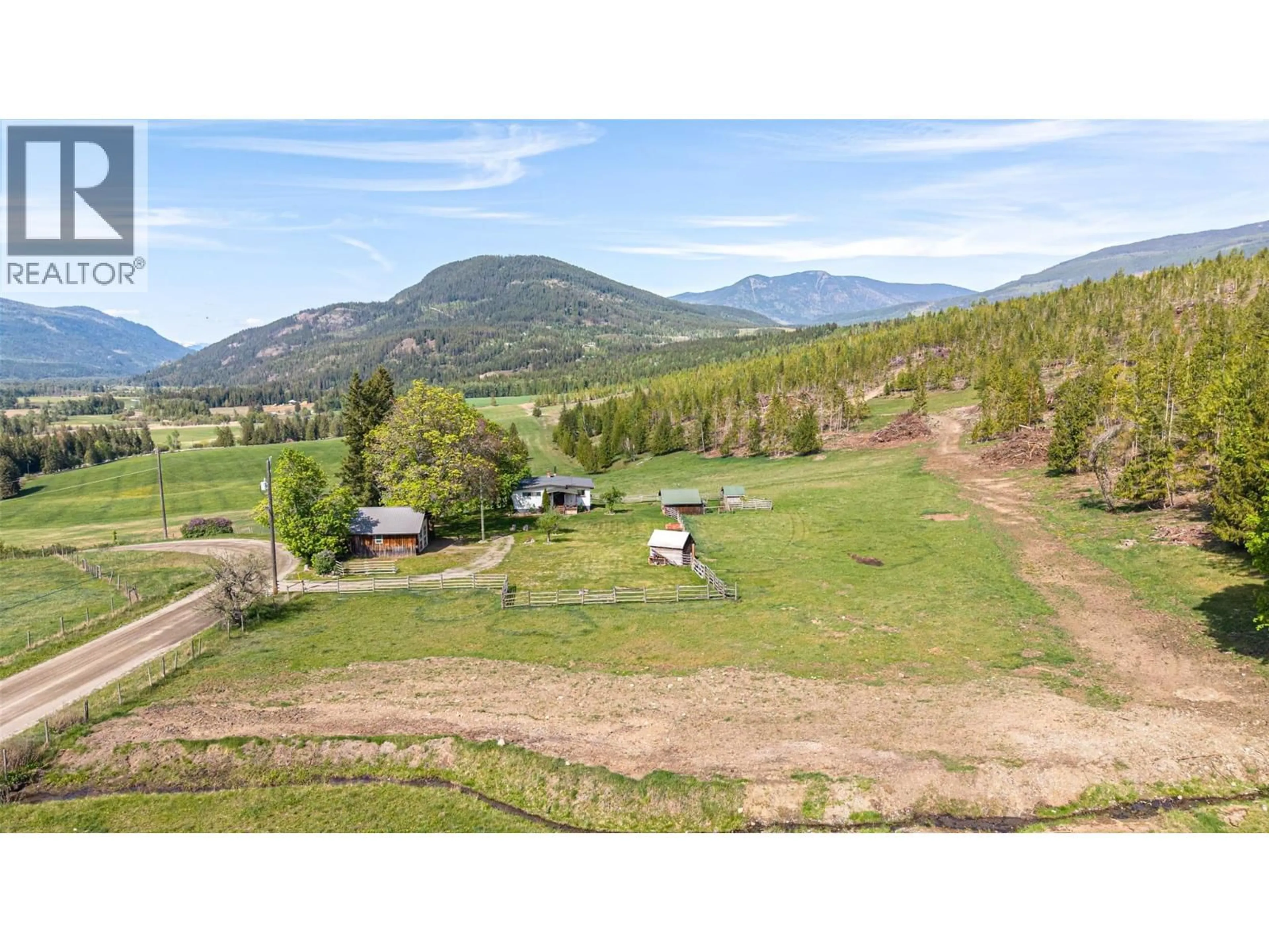 A pic from outside/outdoor area/front of a property/back of a property/a pic from drone, mountain view for 43 SIGALET ROAD, Lumby British Columbia V0E2G6
