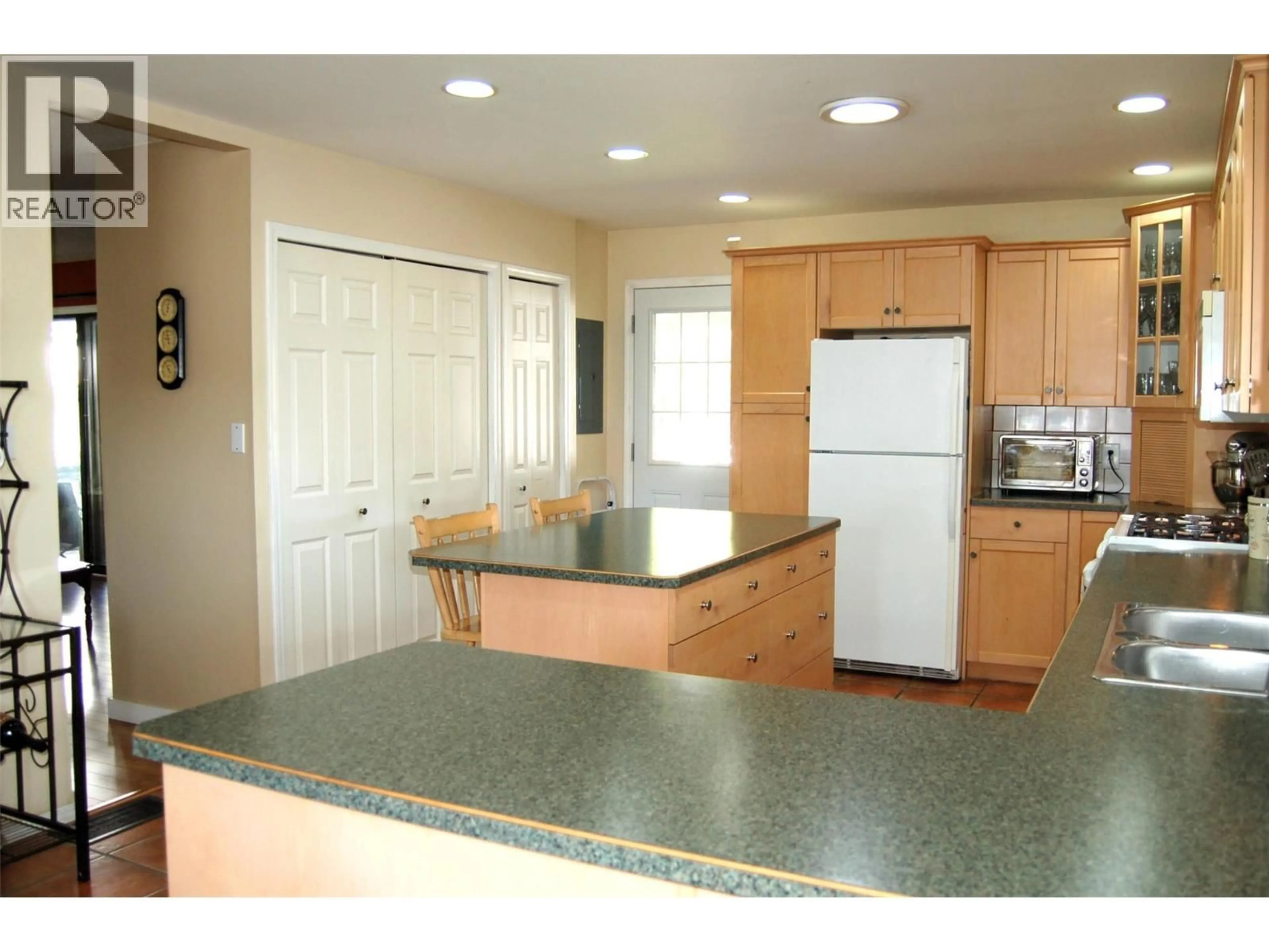 Standard kitchen, ceramic/tile floor for 10504 RITCHIE STREET, Summerland British Columbia V0H1Z5