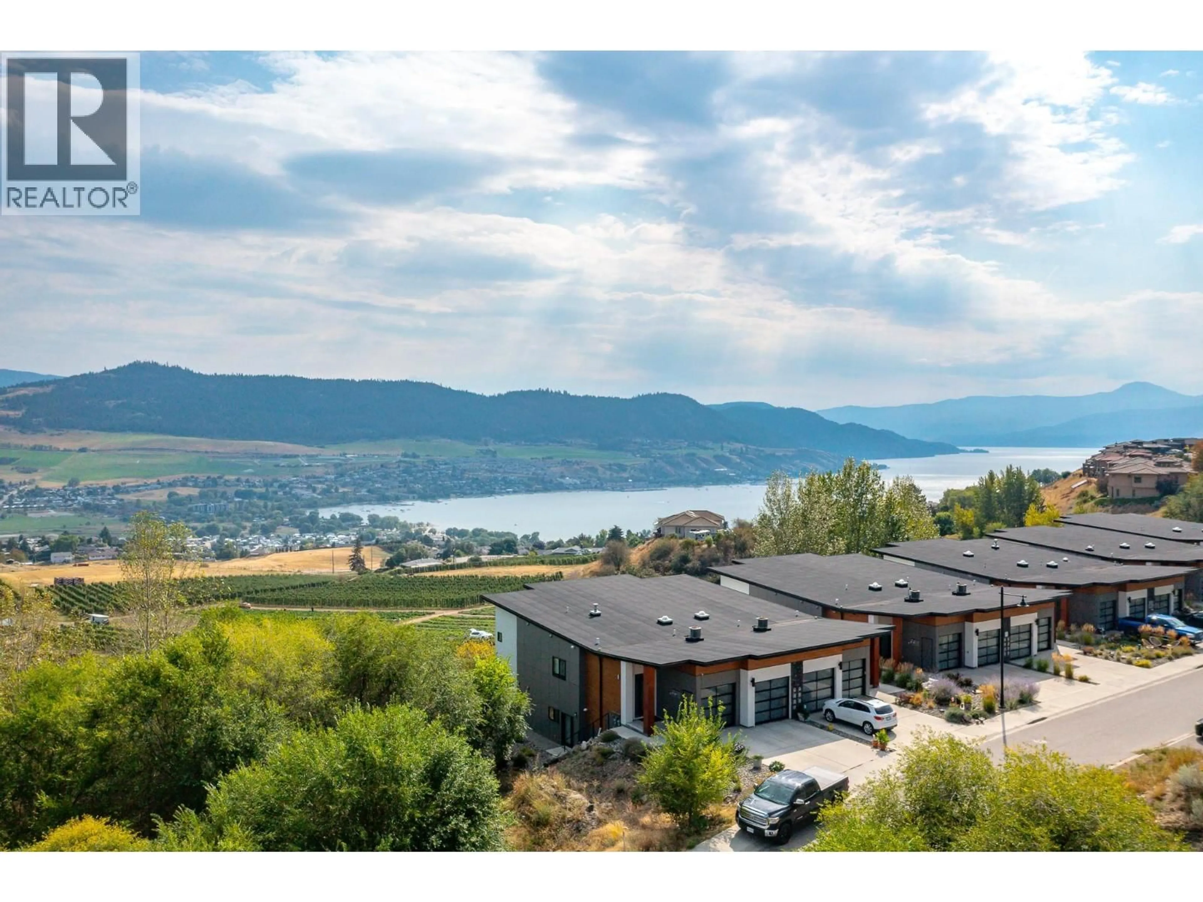 A pic from outside/outdoor area/front of a property/back of a property/a pic from drone, water/lake/river/ocean view for 206 VINEYARD WAY, Vernon British Columbia V1H1Z7